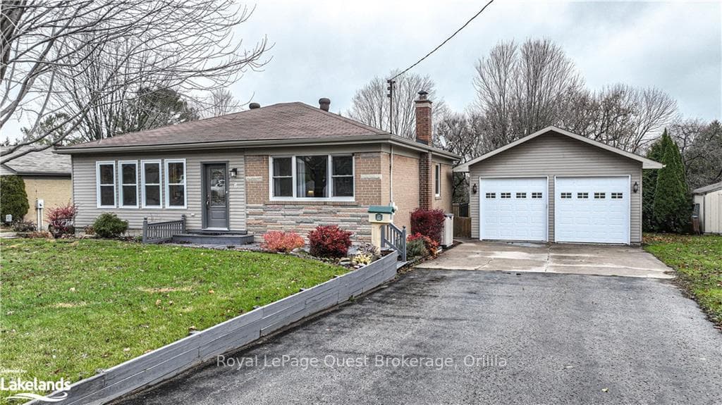 View of front of home with a front lawn, an outdoo