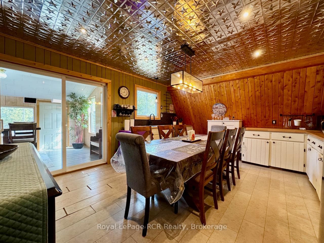 To the custom kitchen with wood & tin finishes too