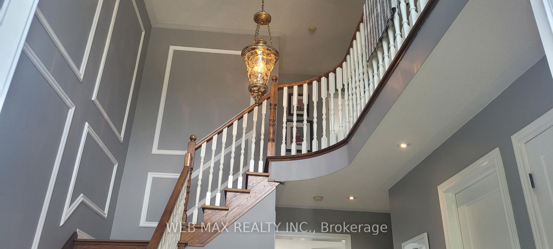 Solid staircase with chandelier
