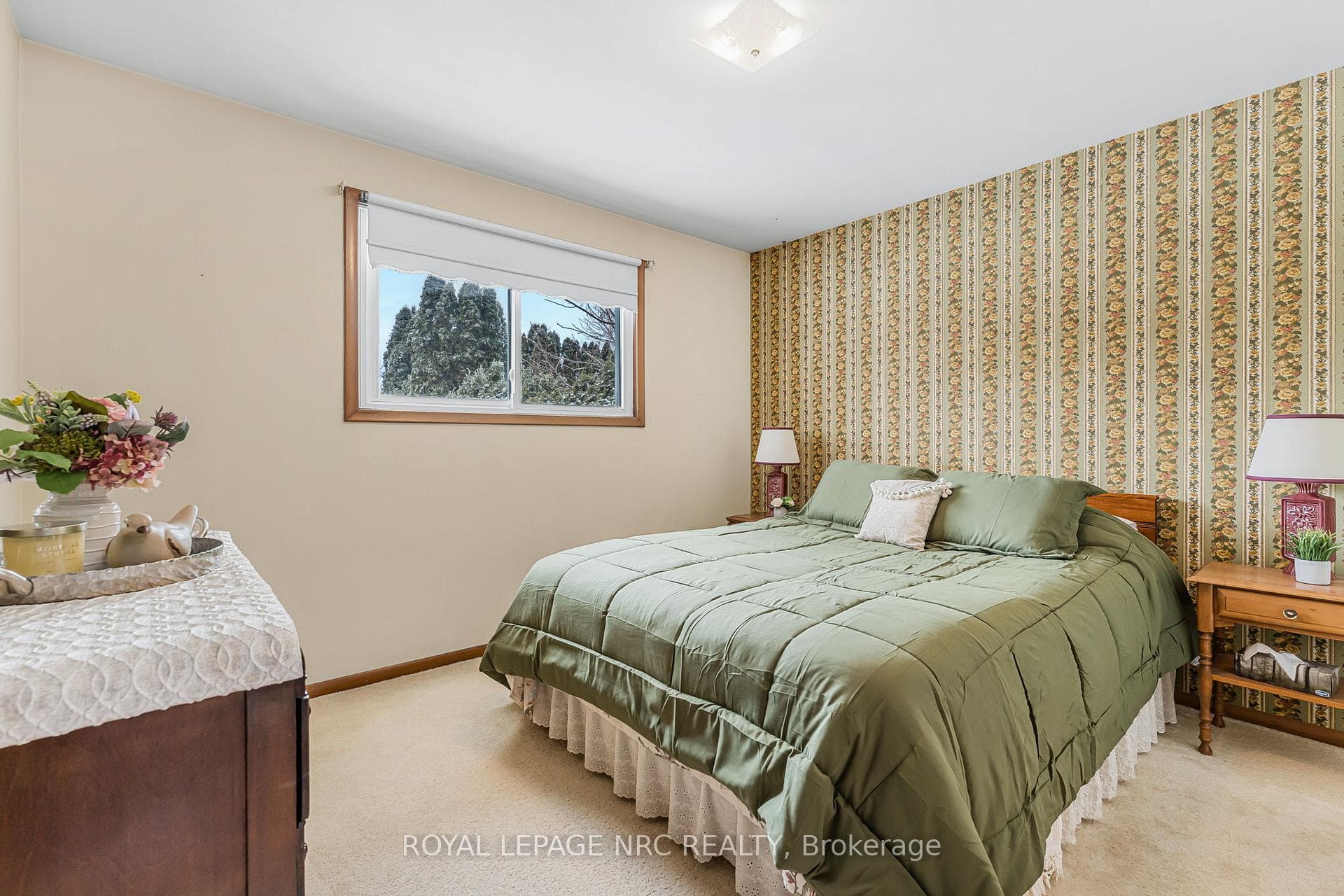 Second bedroom looks out to backyard.