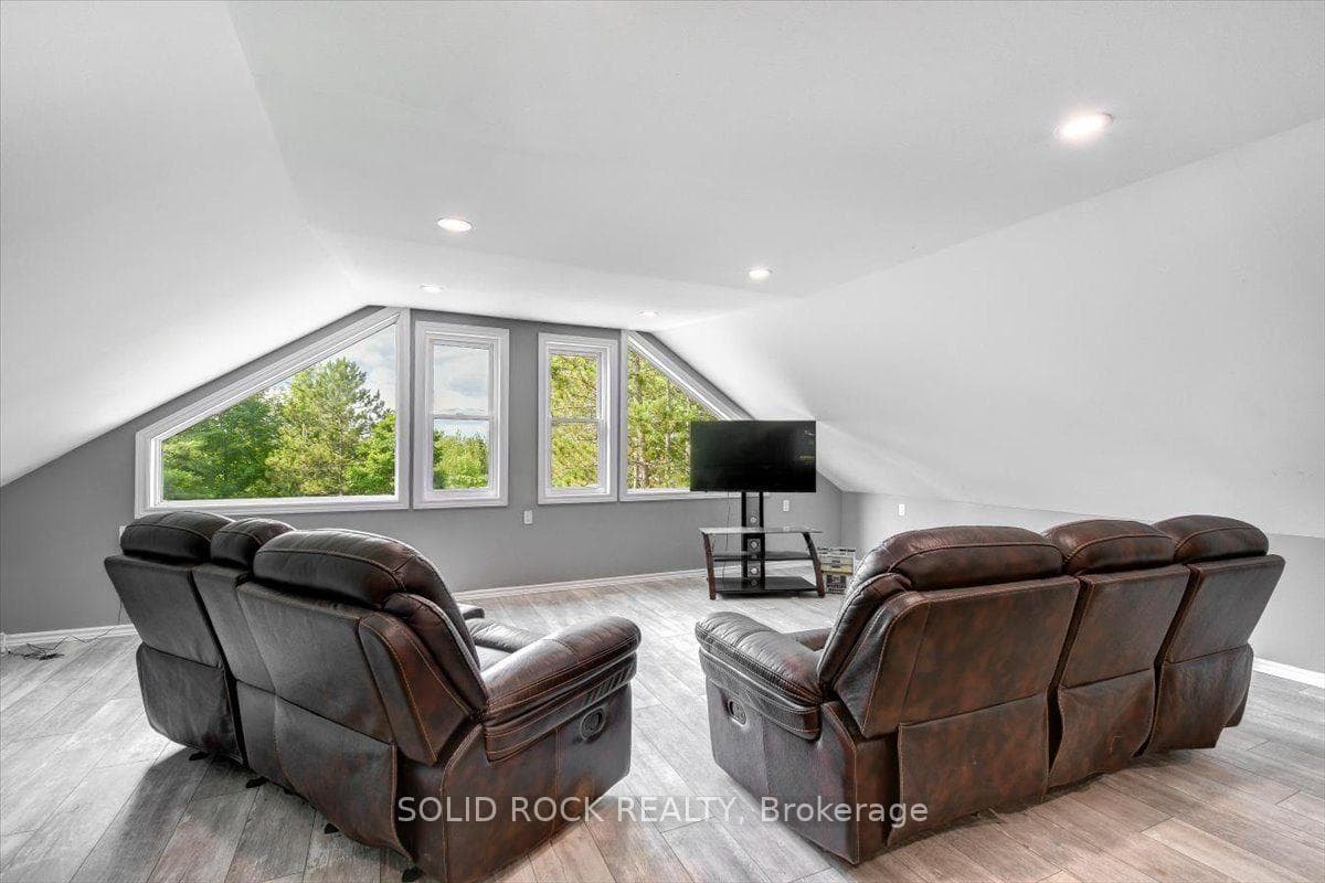 Loft With Picture Window & Exit to Balcony