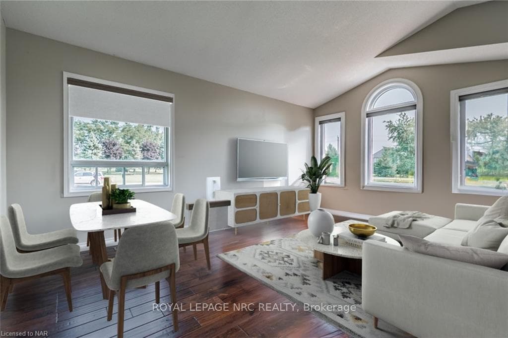 Virtually staged to show dining table and sectiona