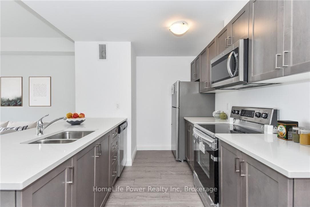 Modern galley kitchen (Virtually Staged)
