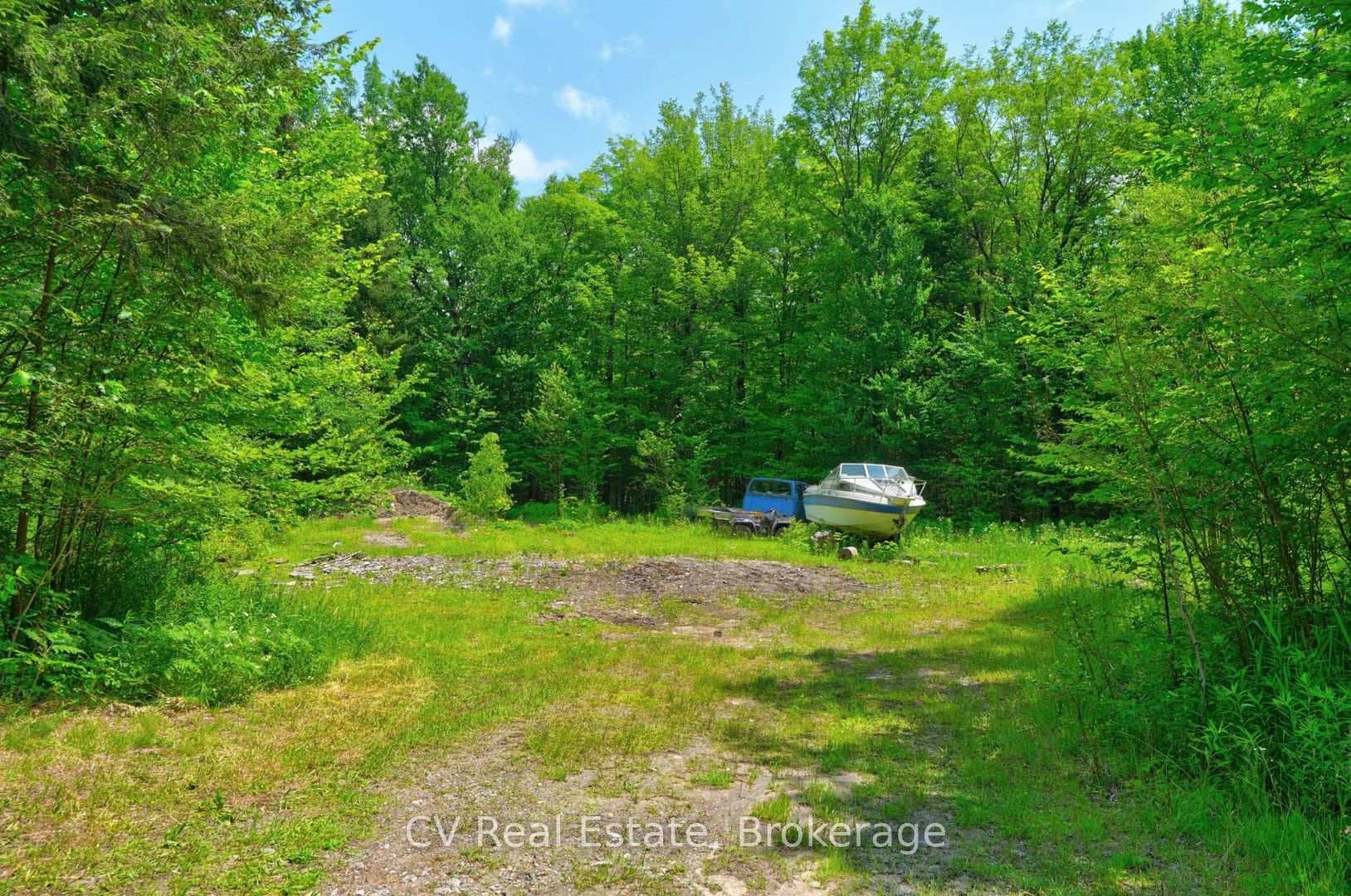 Cleared building lot by road