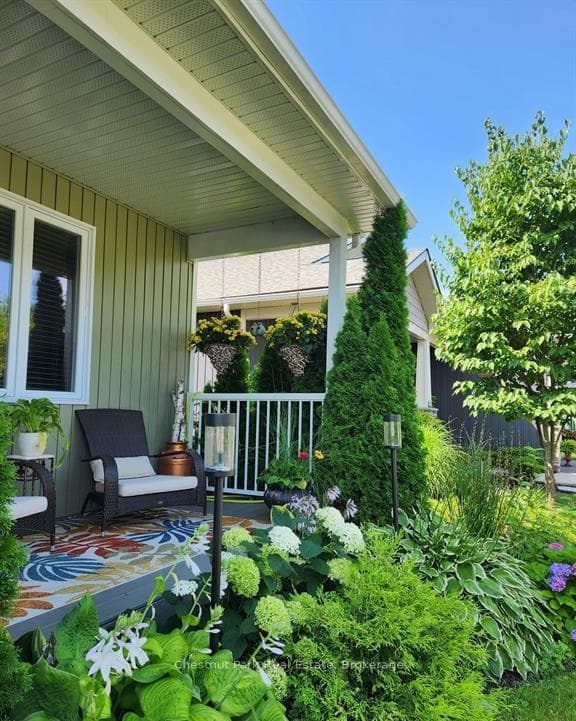 Fabulous front porch & stunning perennial gardens