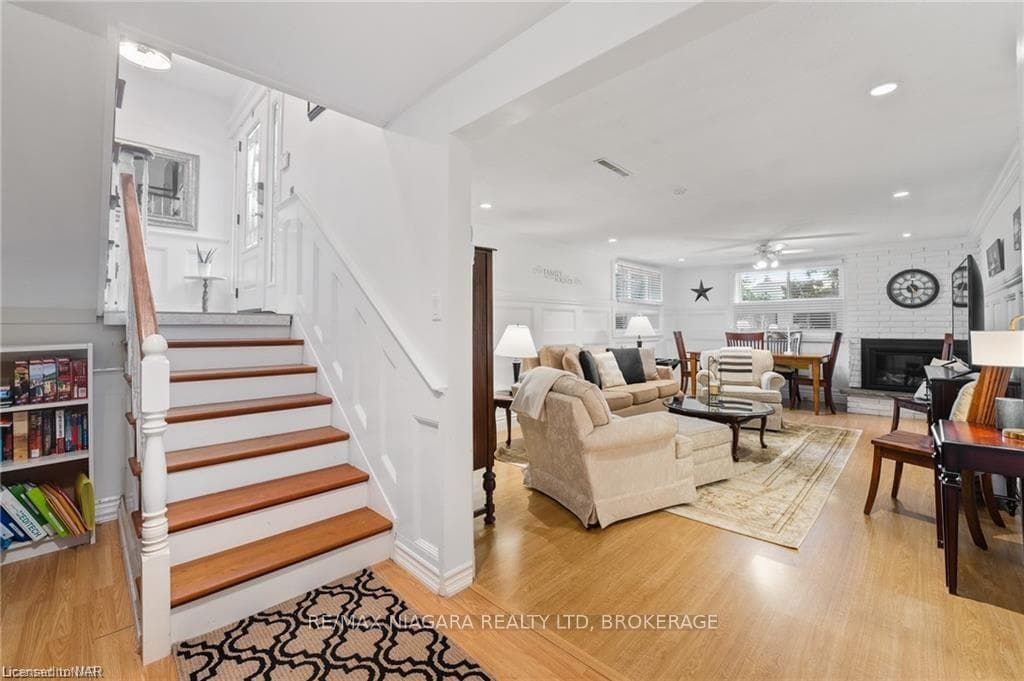 Living room with light wood-type flooring, ceiling