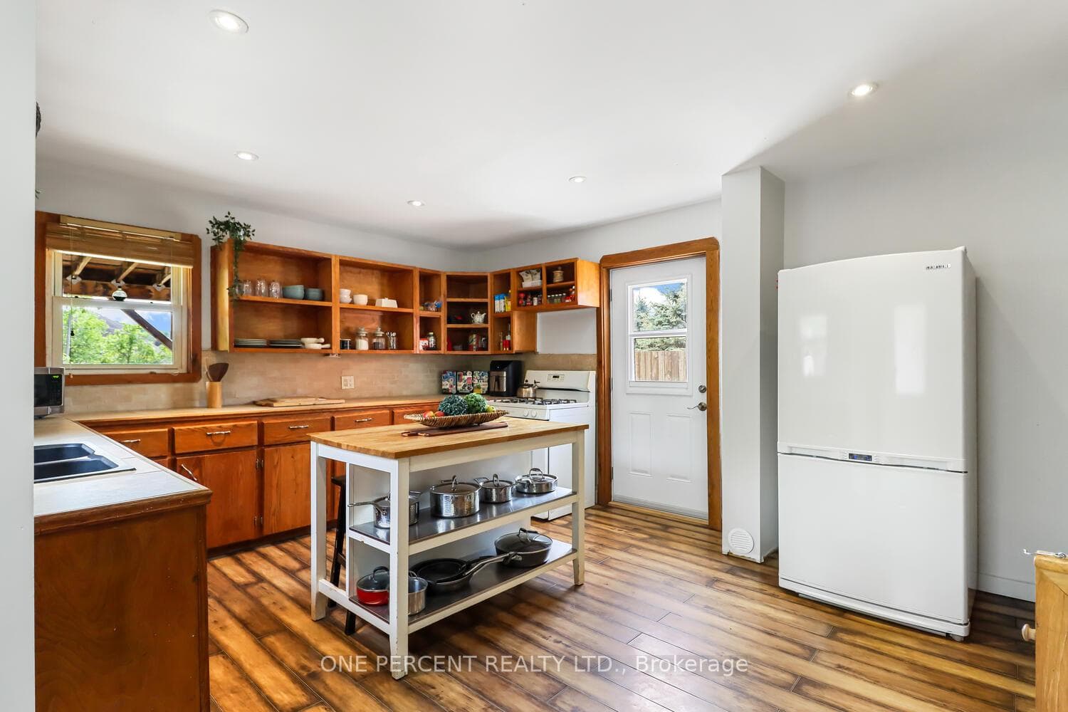 Kitchen opens up to the large deck & yard
