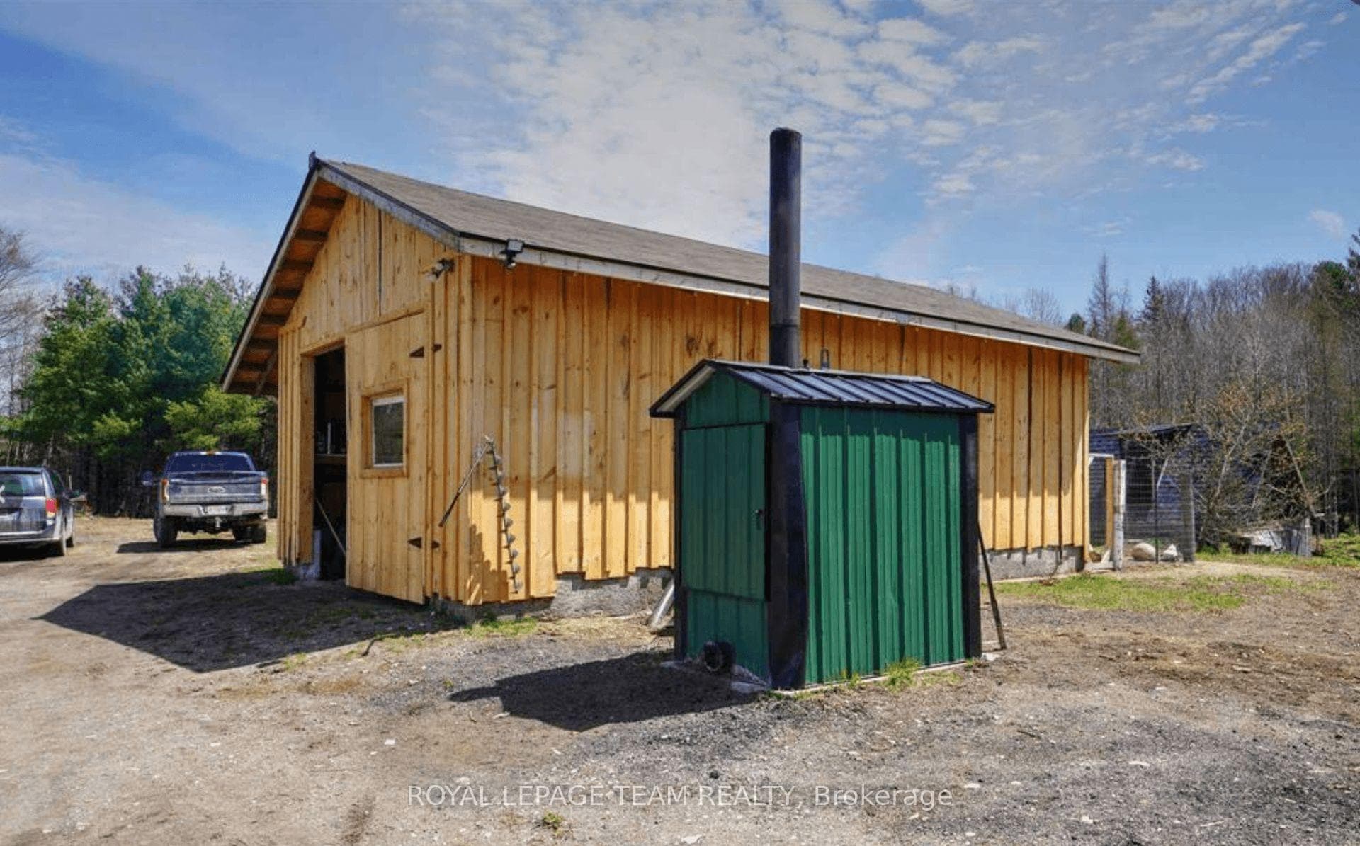 Detached garage with wood furnace