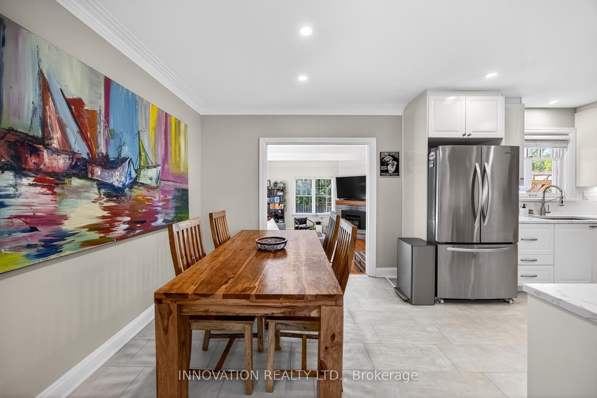 Dining open to kitchen and family room
