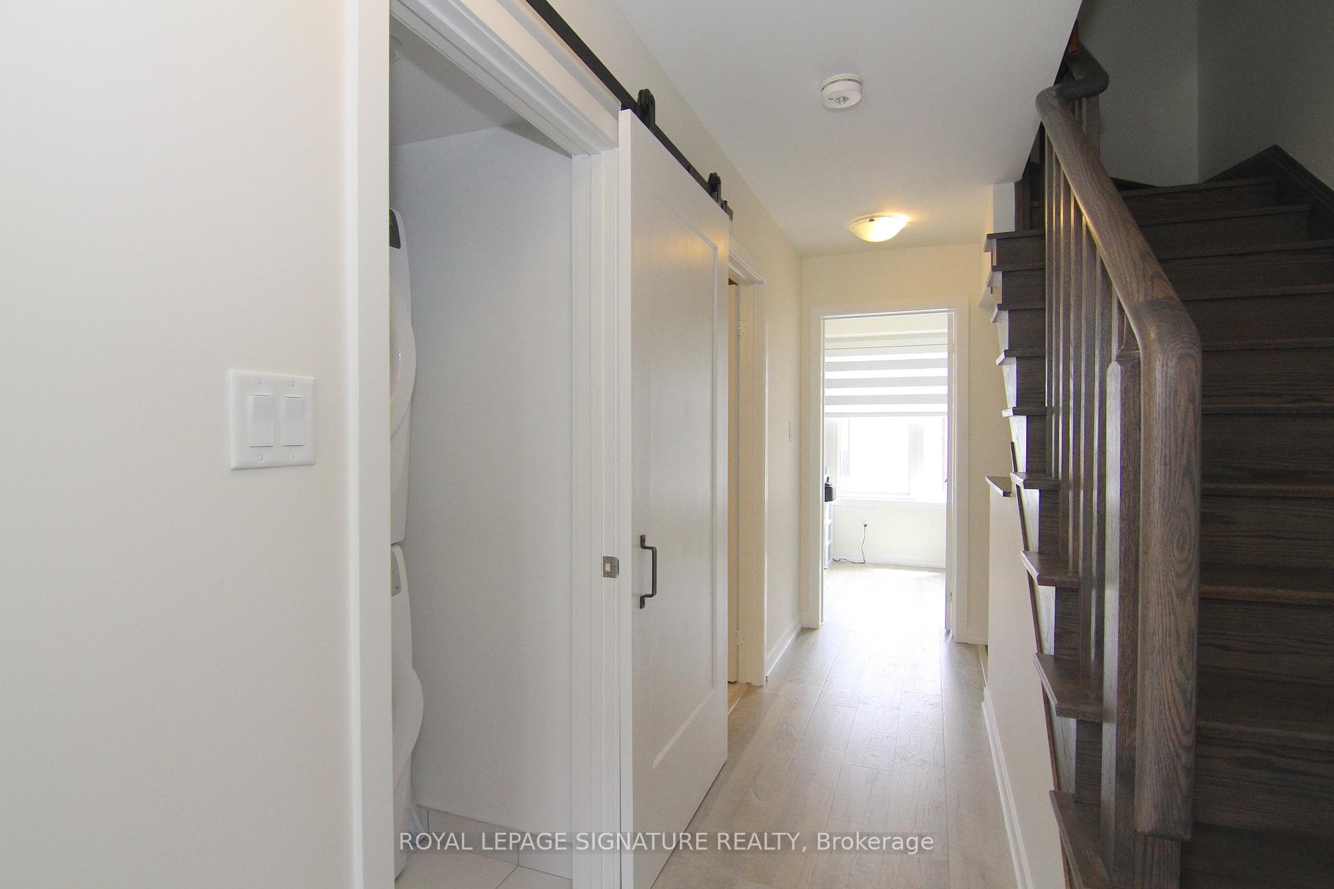 Second floor hallway w/ laundry