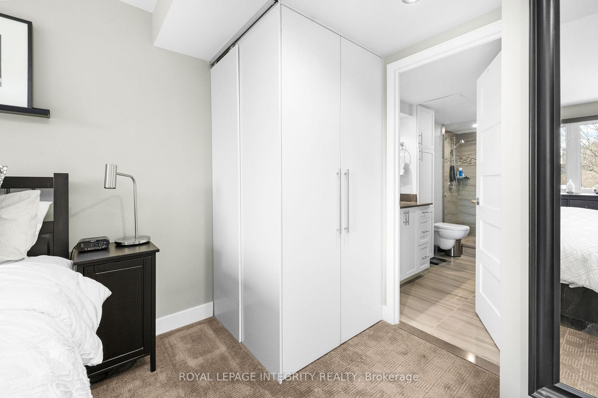 Primary bedroom facing ensuite bathroom