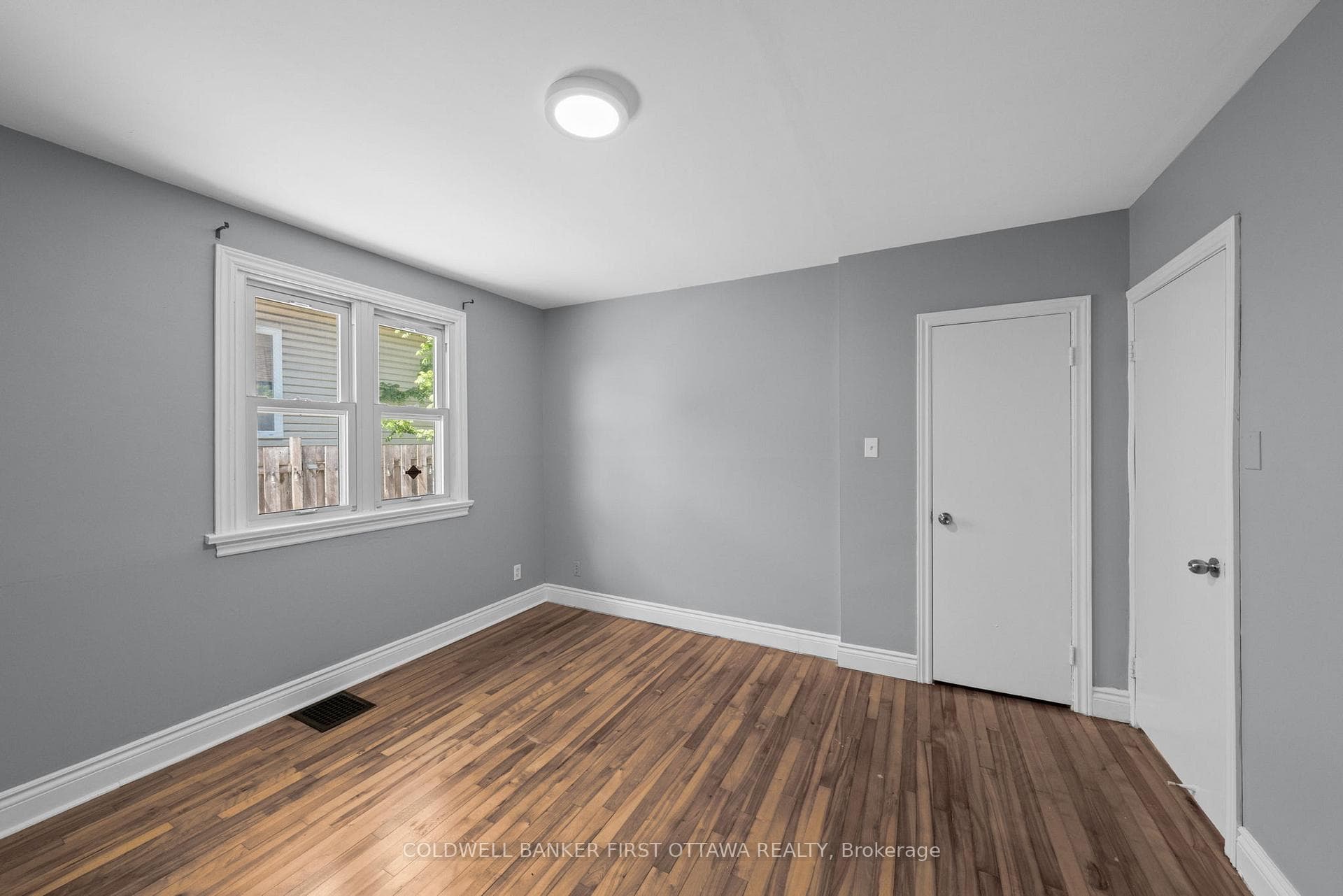 Closet space & bright dbl window w blinds.