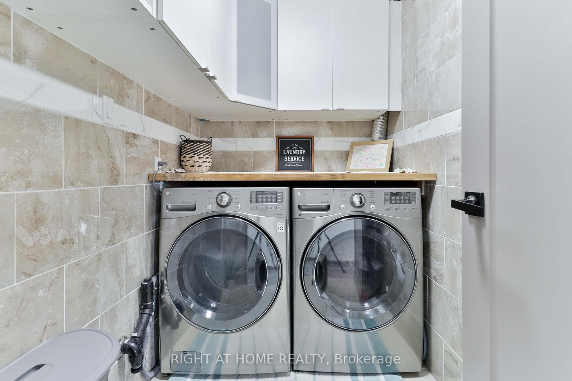 ensuite laundry and linen closet/storage