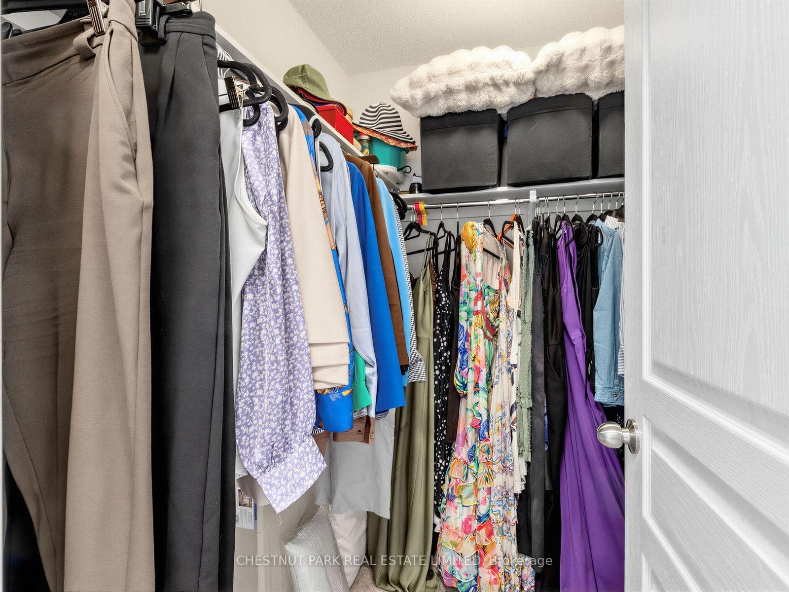 Primary bedroom walk-in closet