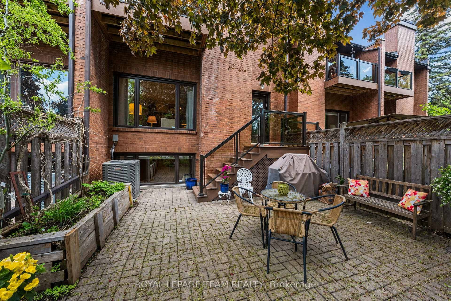 No grass backyard with bbq and beautiful garden