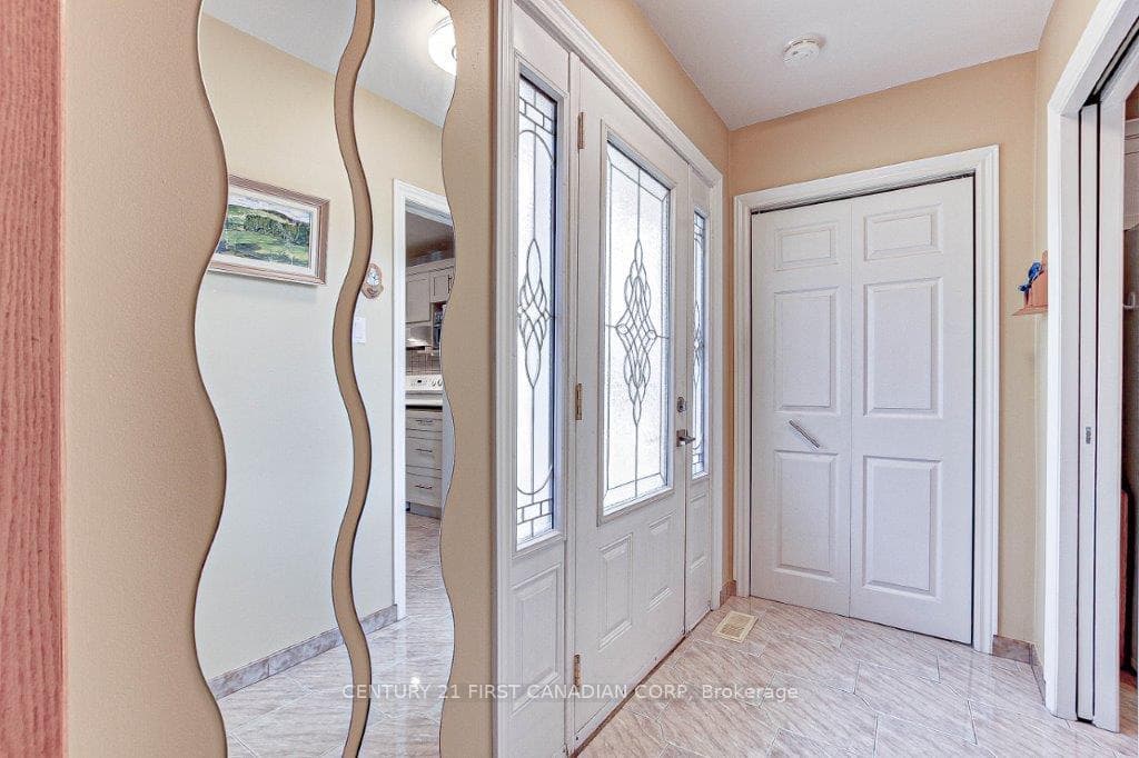 Front entrance with closet and pocket door