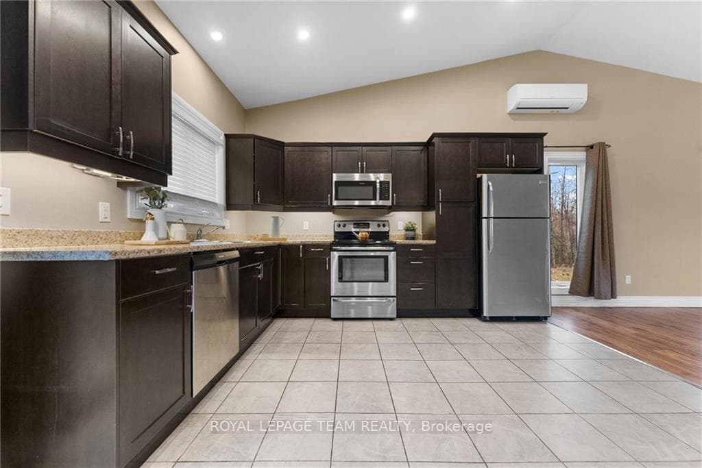 custom kitchen with stainless steel appliances
