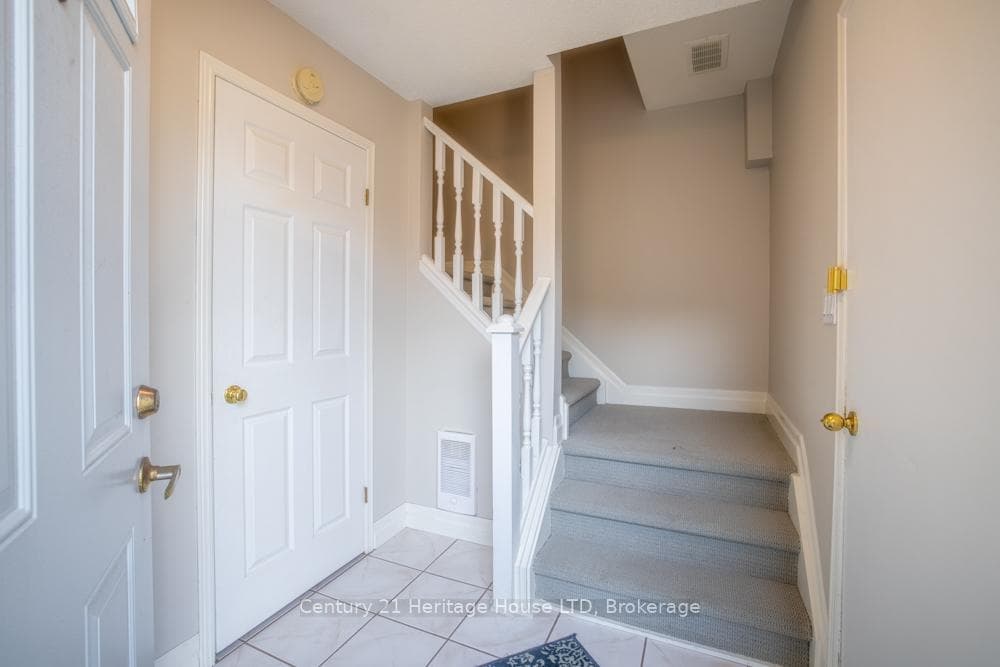Main Foyer - w/closet & door to garage on right.