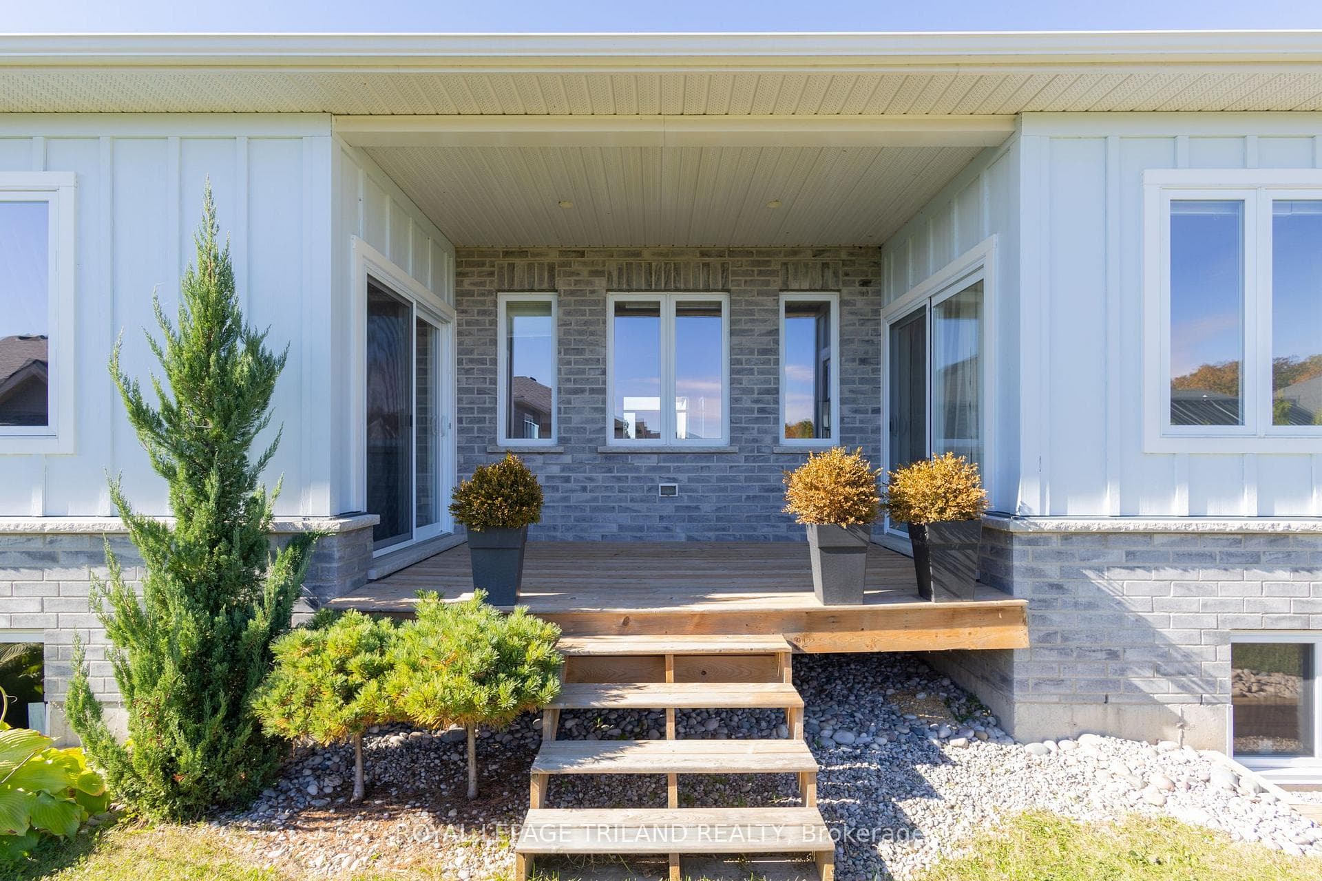 Backyard covered sundeck off kitchen