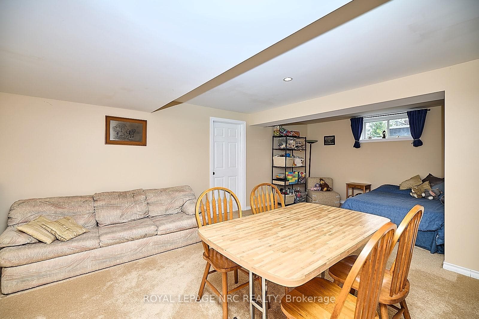 Recreation room with room partioned for bedroom