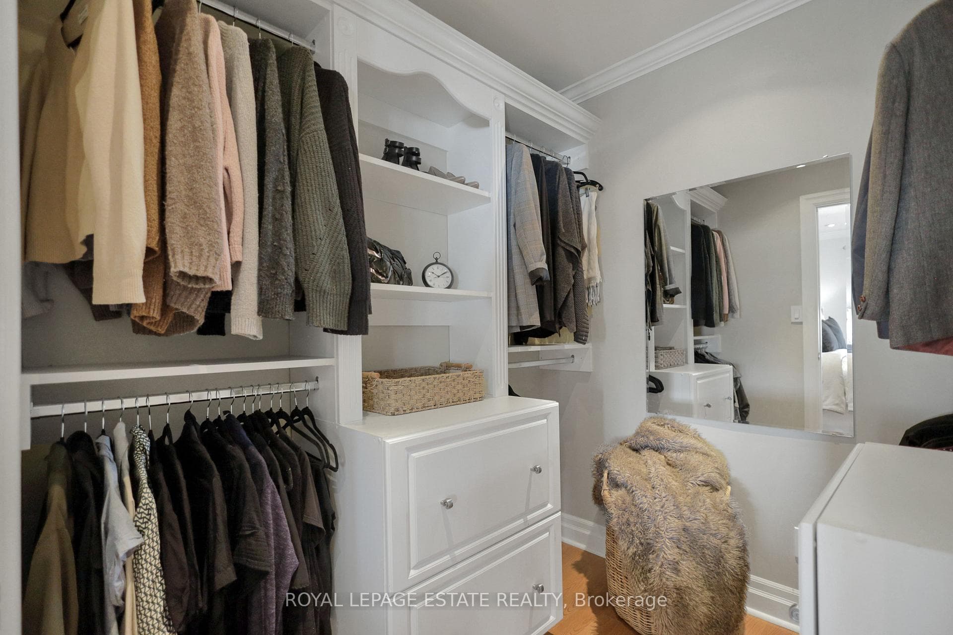 A spacious custom walk-in closet.