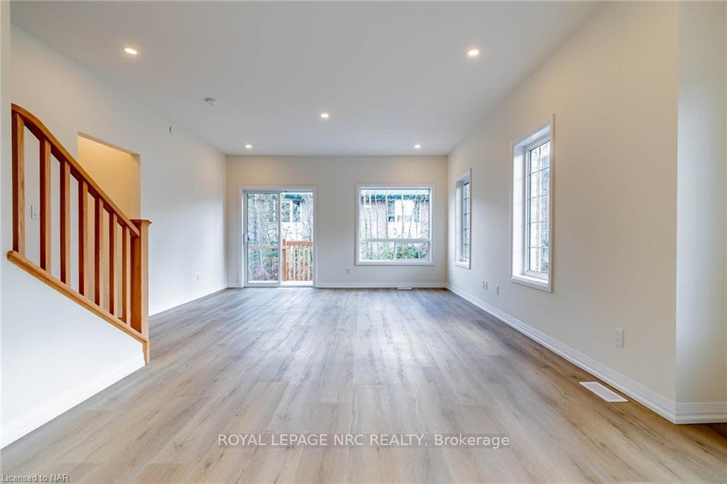 Unfurnished living room with light wood-type floor
