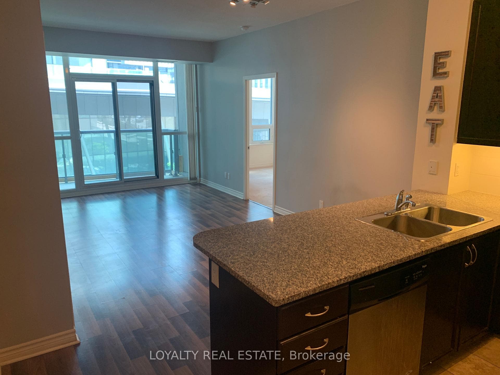 Kitchen looking over living area