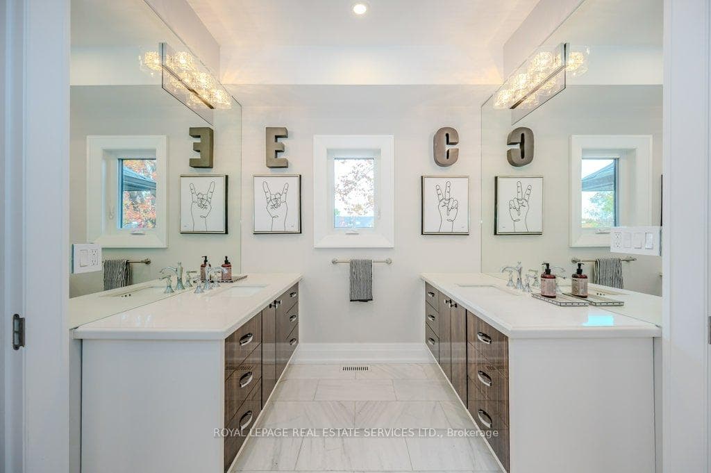 Shared Designer Bathroom with Dual Vanities