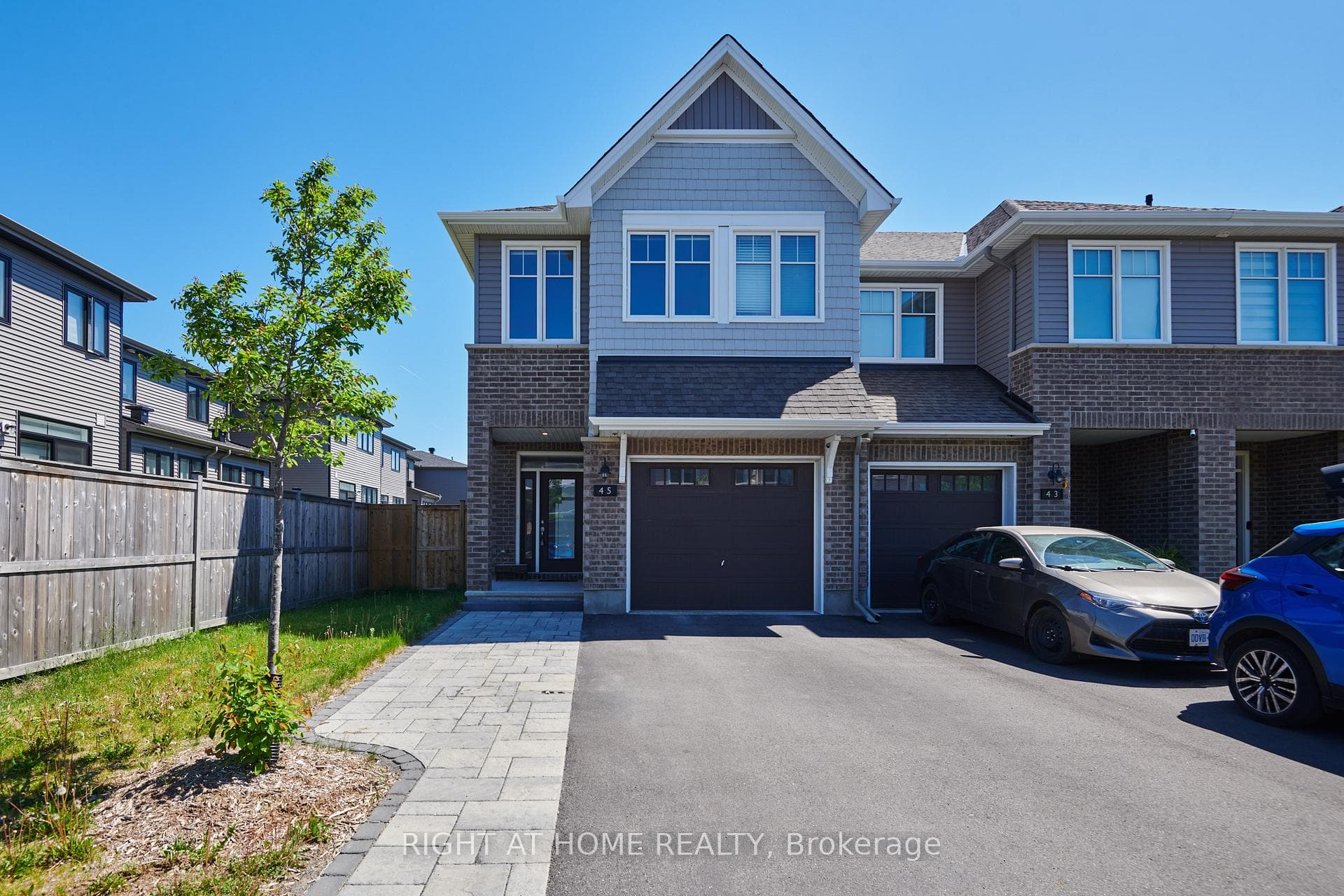 Beautiful End Unit with extra parking pad!