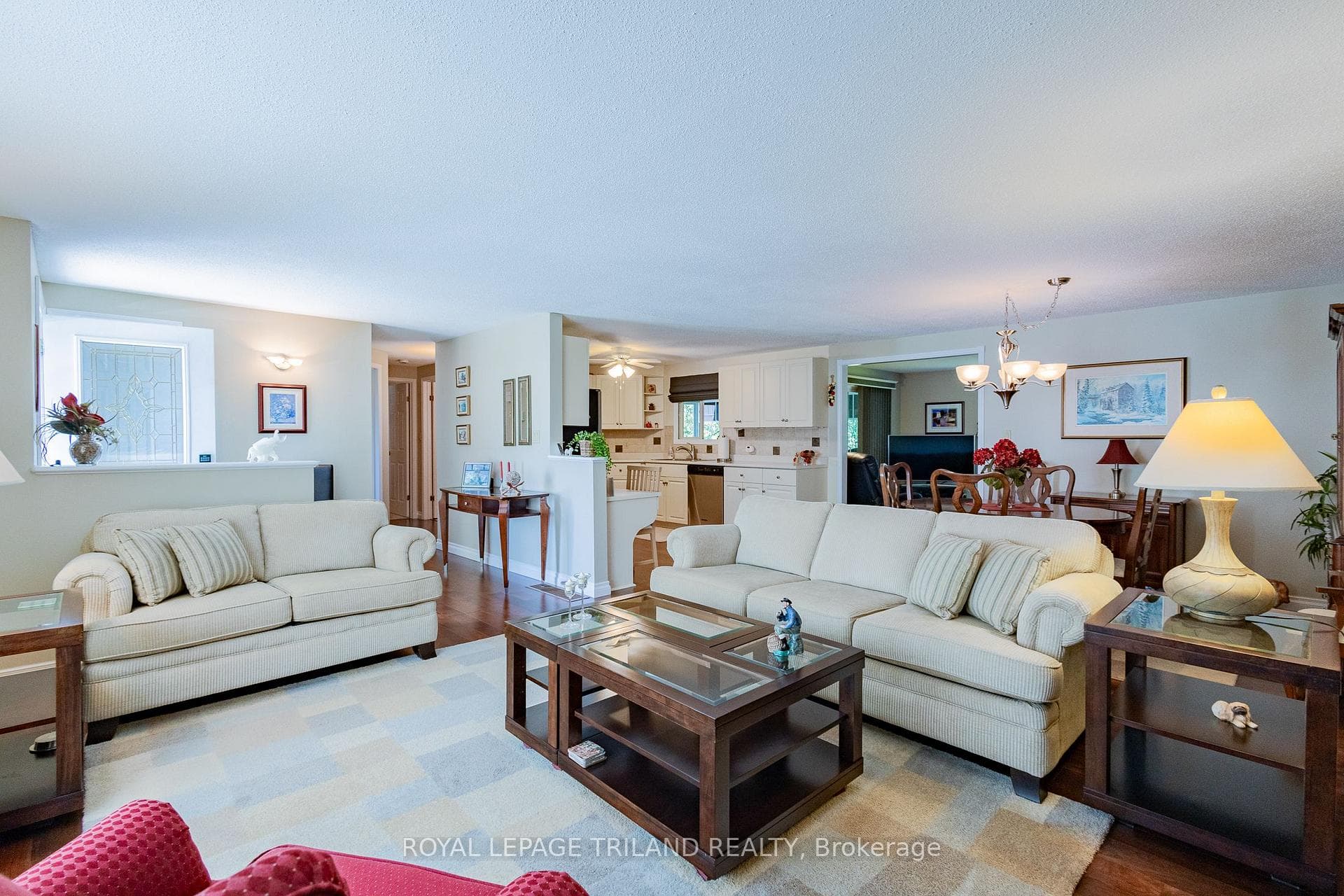 Open-concept primary living area w/ gas fireplace