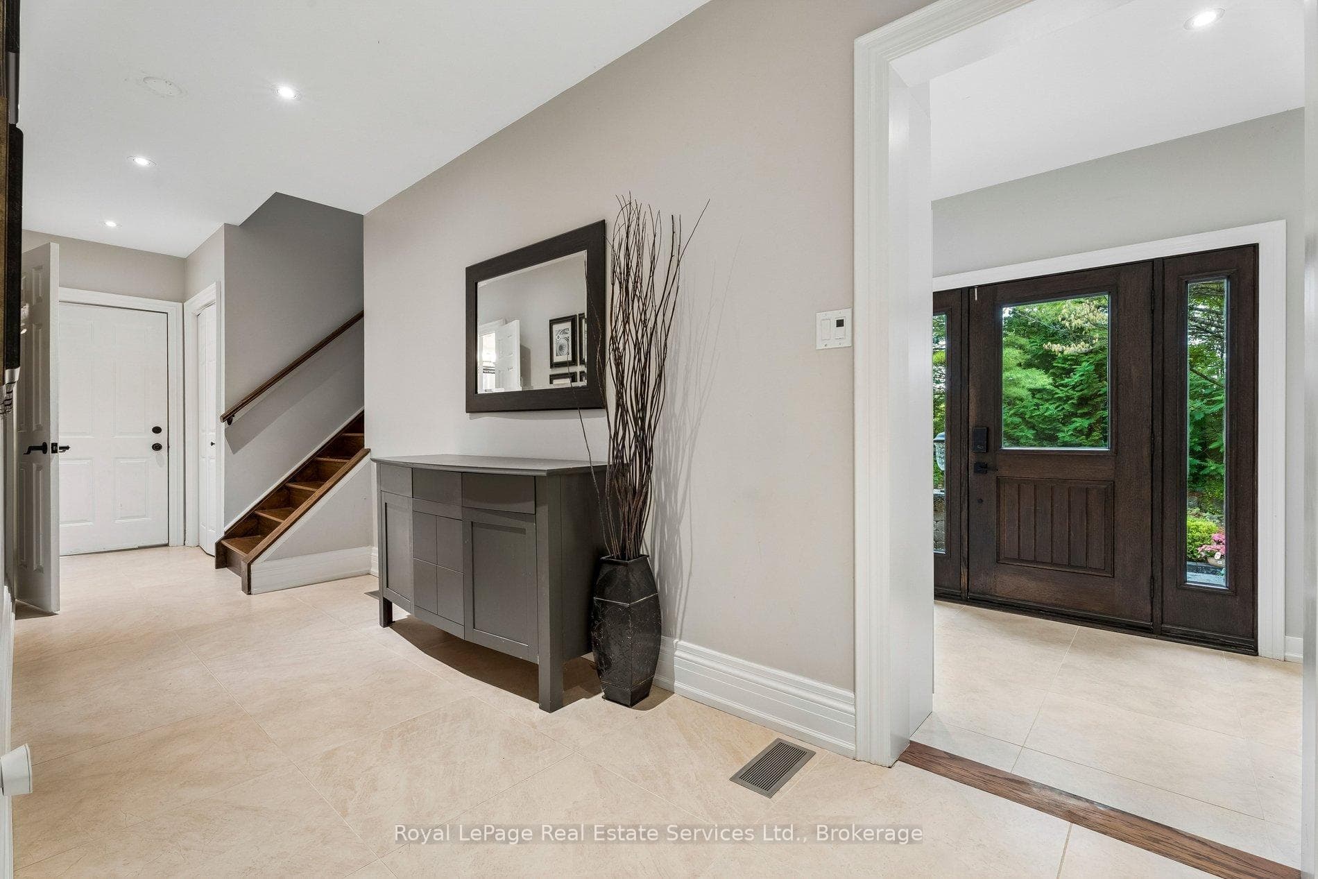Garage door, powder room, stairs to nanny suite