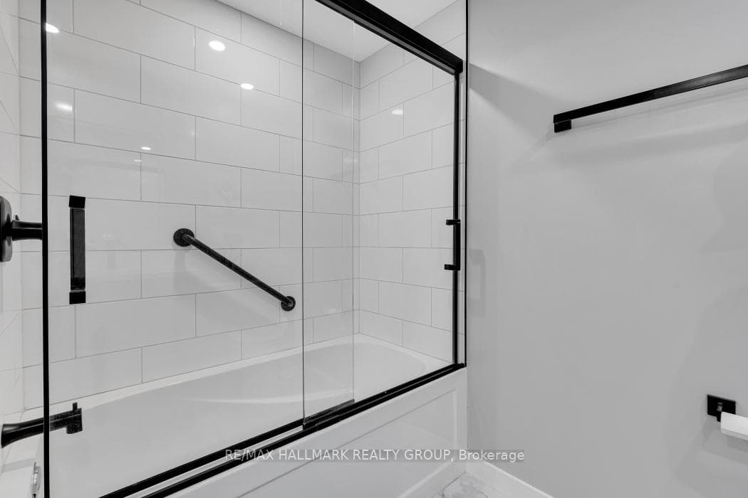 Glass enclosed shower.