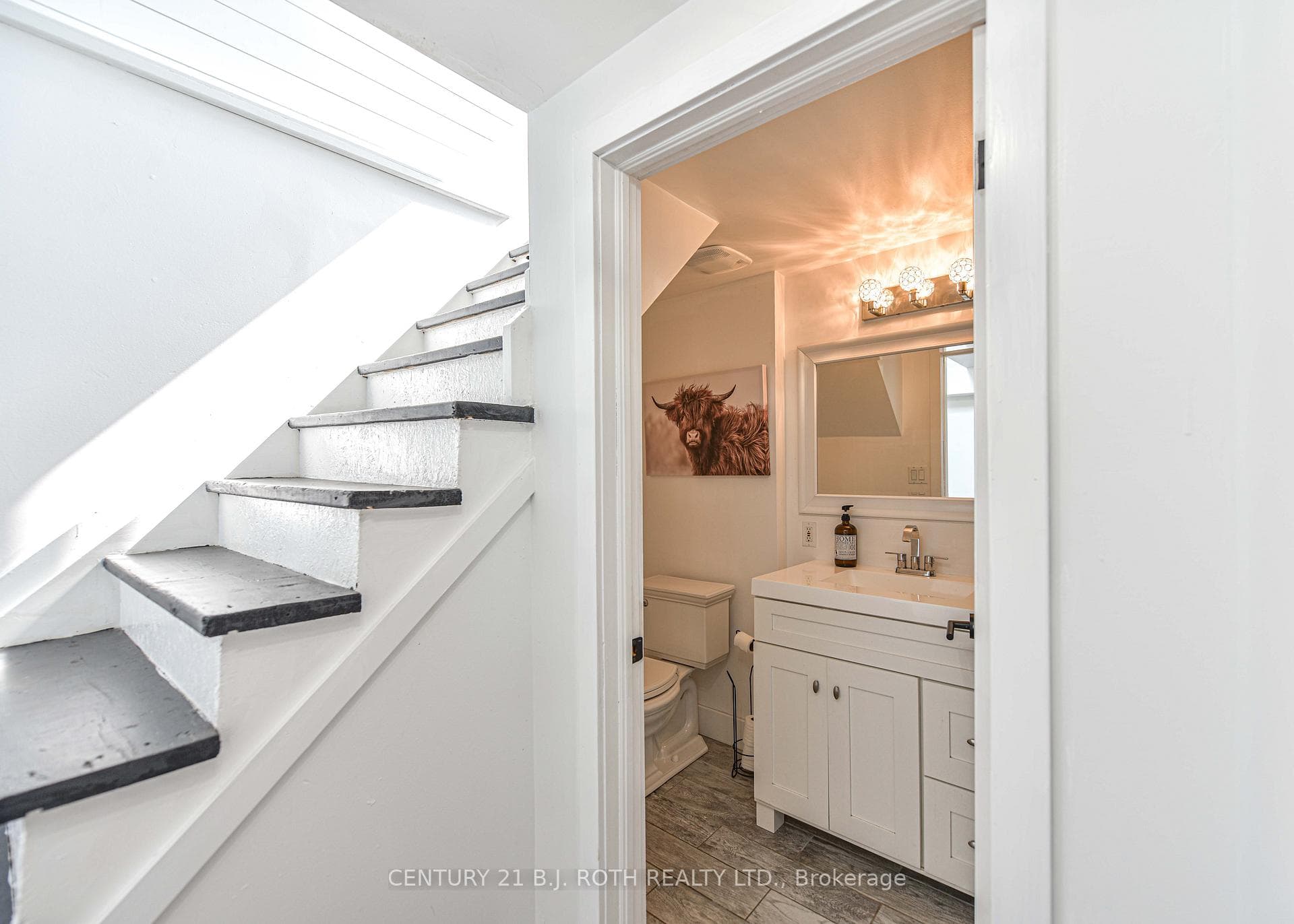 Stairs to lower level and 3 piece bathroom