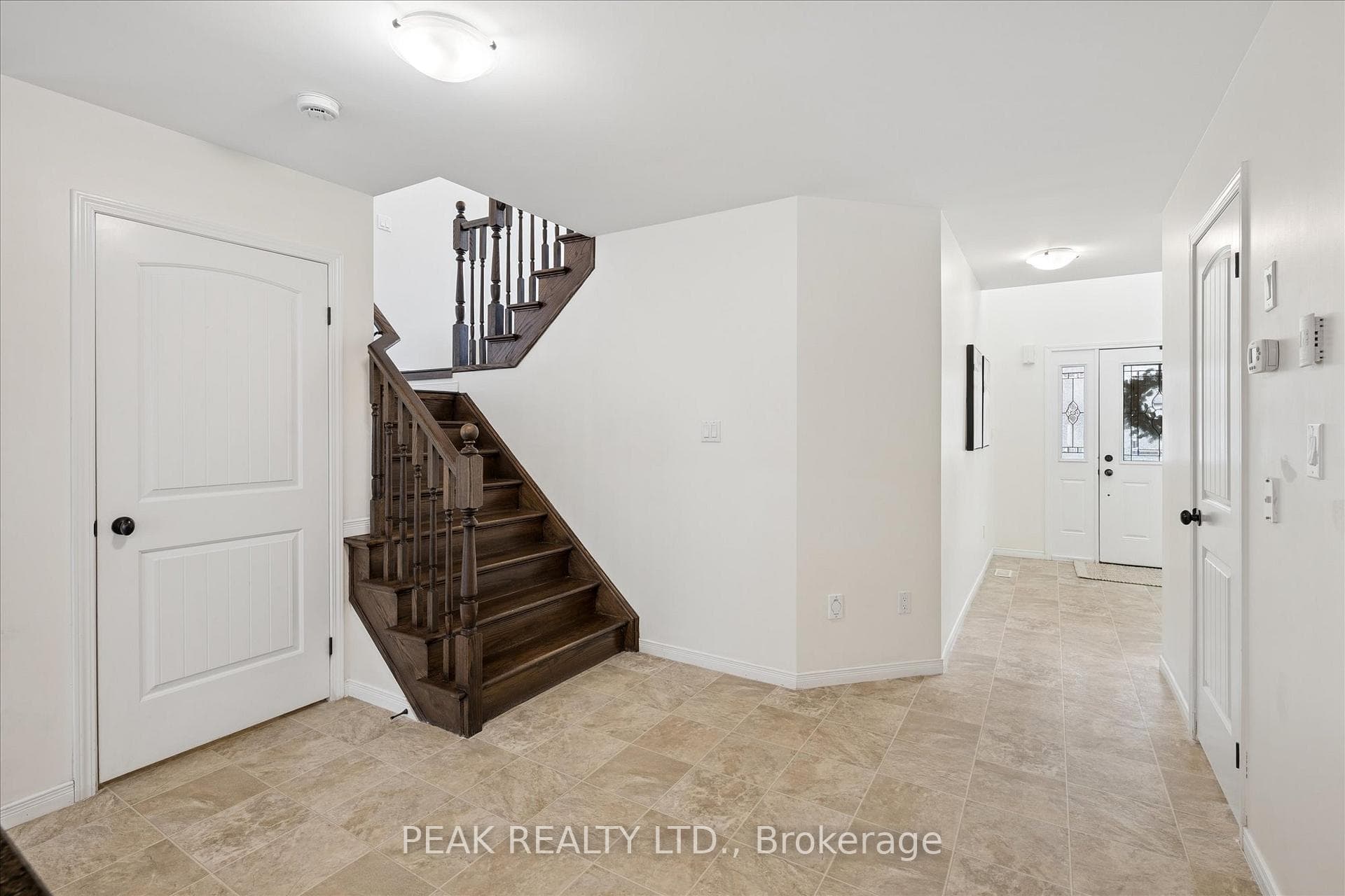 Hardwood stairs leading to upper Family room