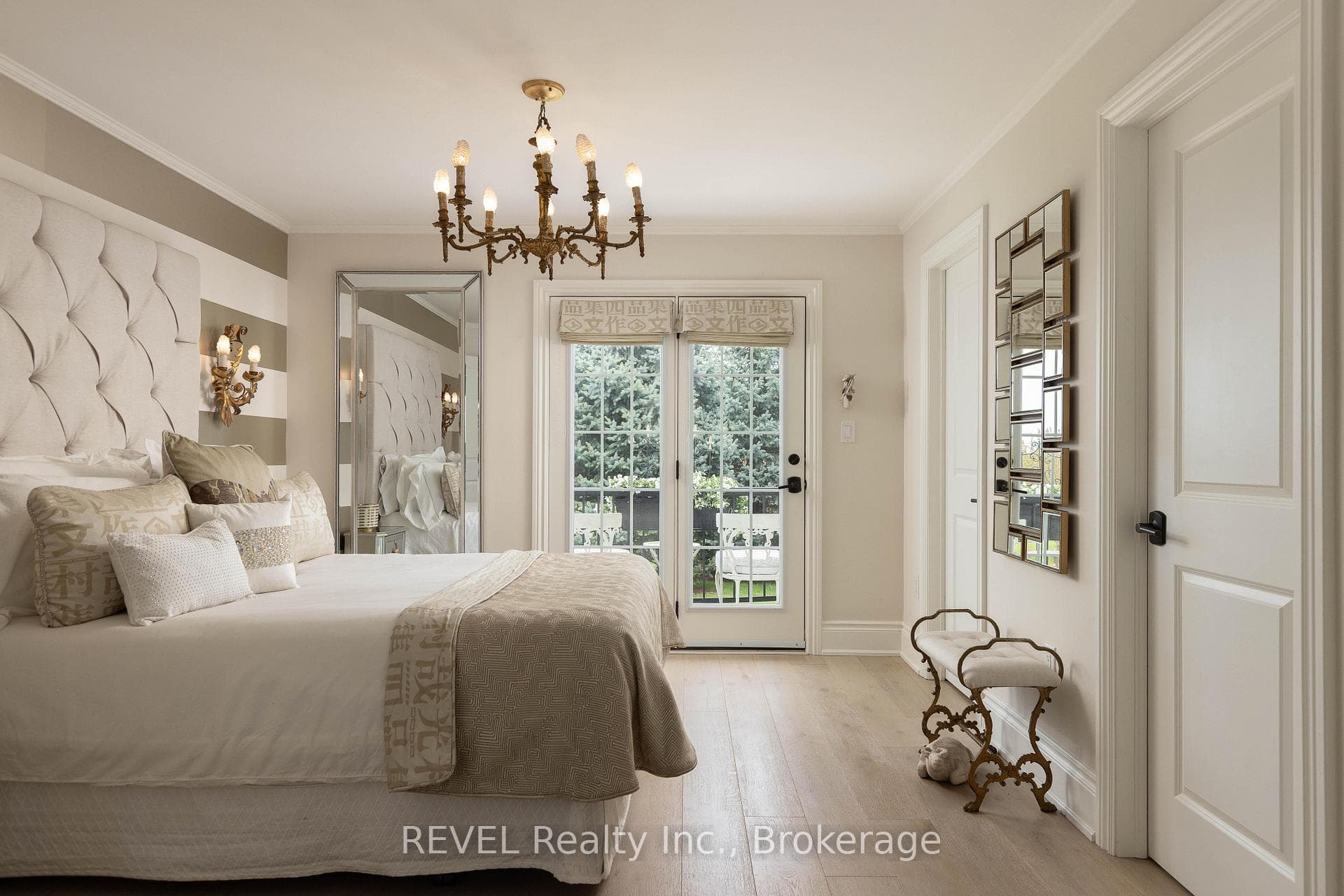 Double doors leading to a private balcony.