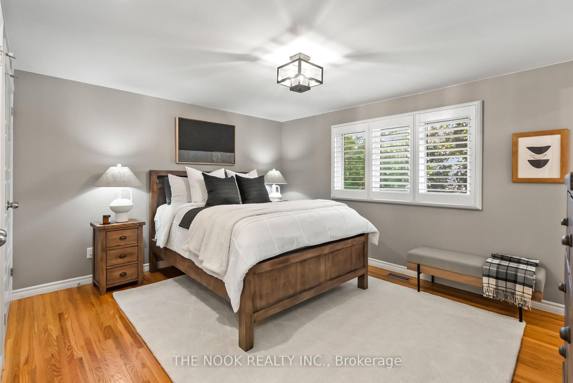 Spacious primary bedroom overlooking the backyard