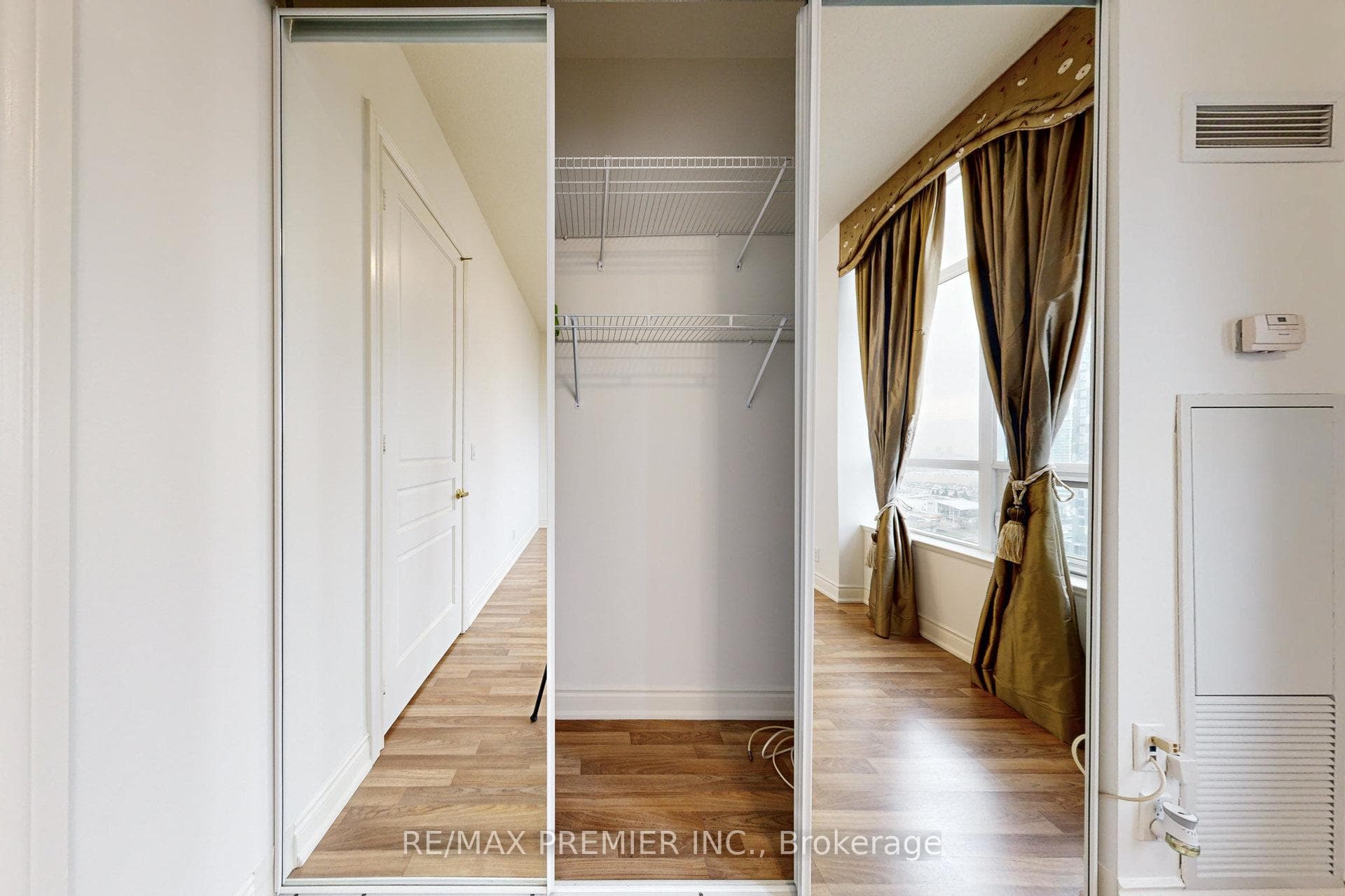 DOUBLE WIDTH MIRRORED CLOSET FOR PLENTY OF STORAGE