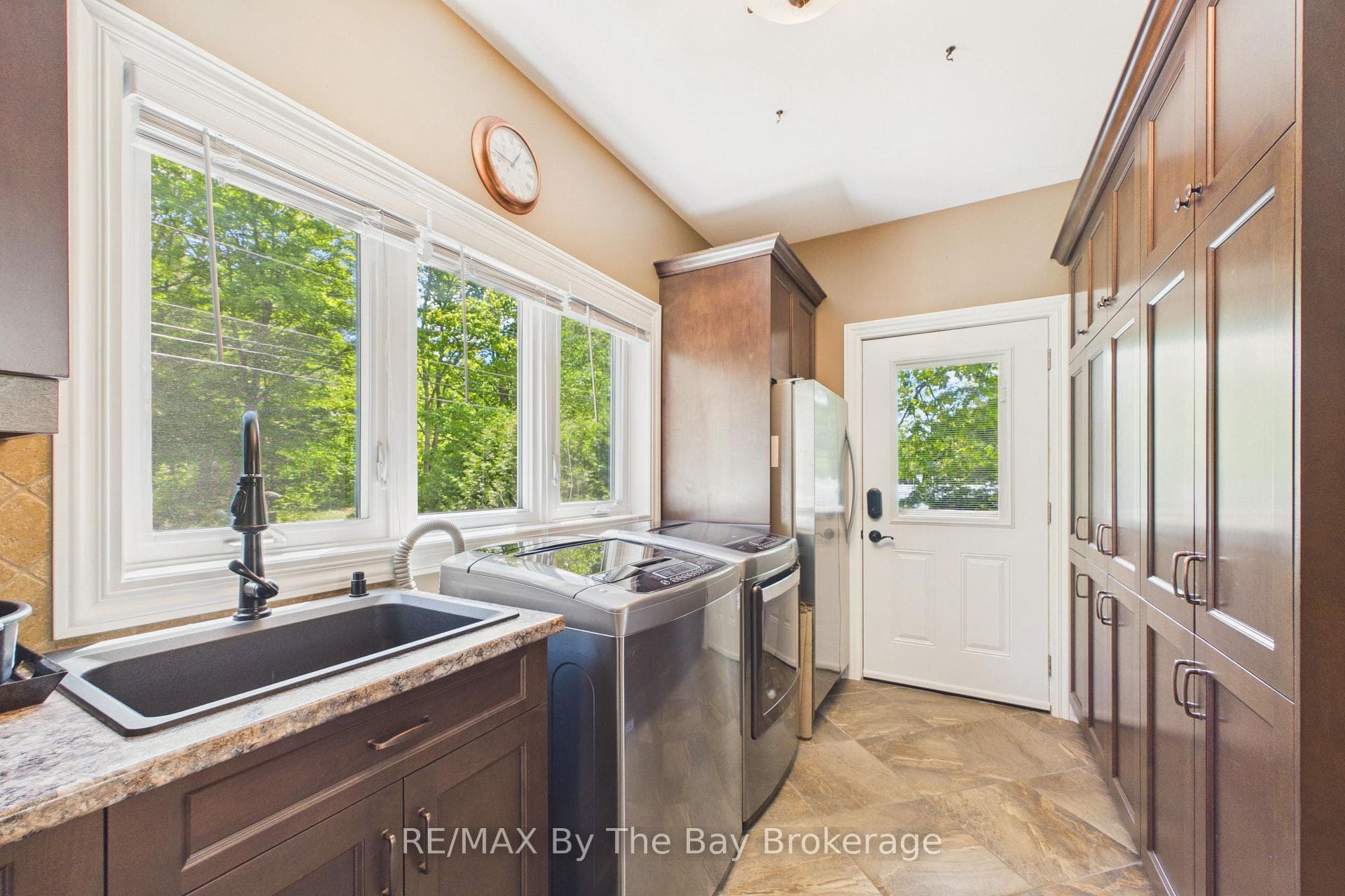 Main Floor Laundry, Ample Storage, Side Entry Door
