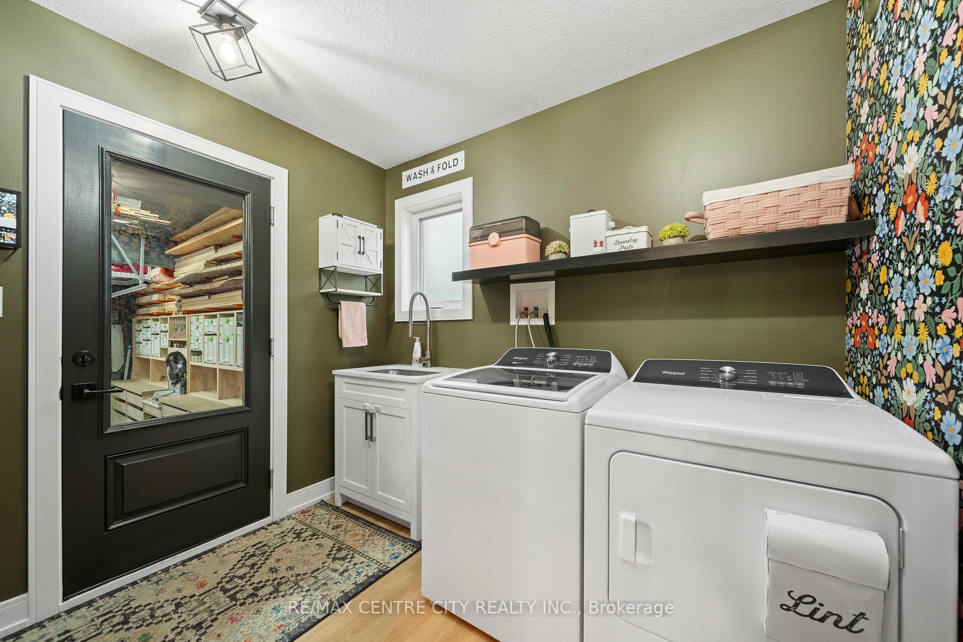Laundry Room Leading to Highly Functional Garage