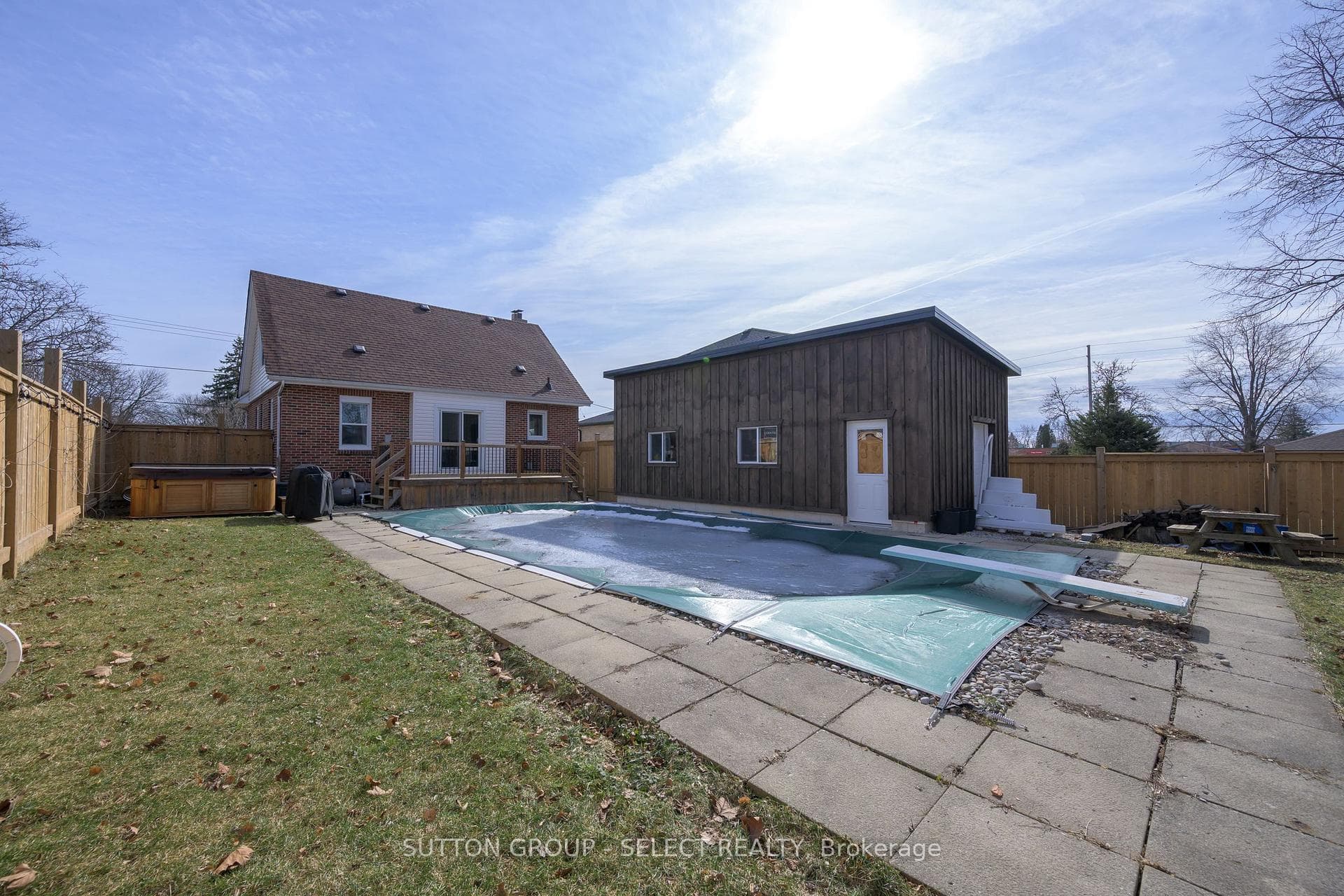 winter view of pool and new garage