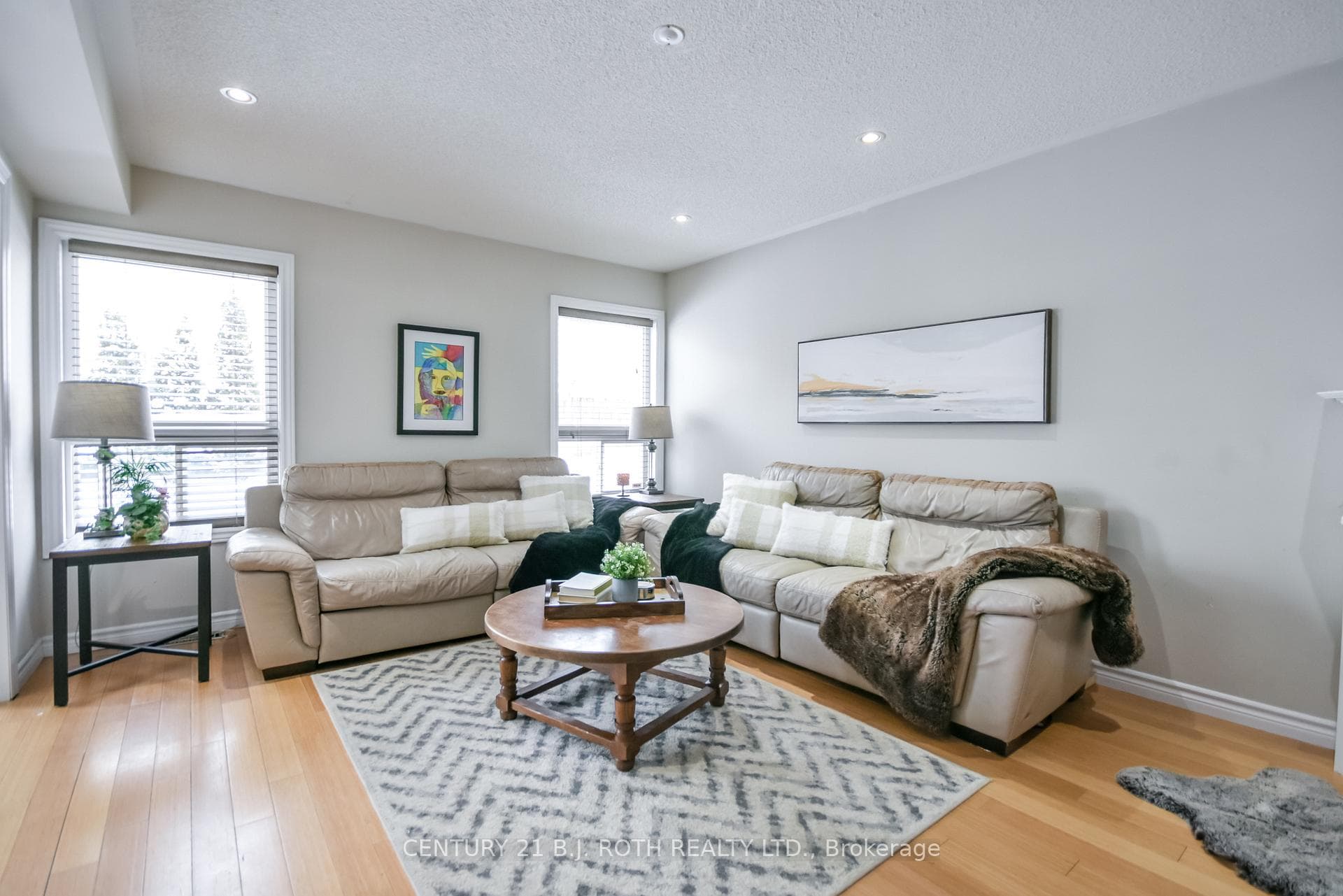 Open concept family room with hardwood floors.