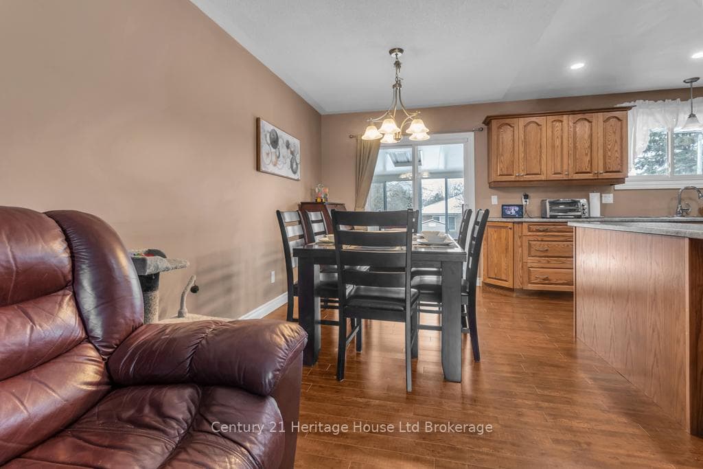Dining room with patio doors to 3 season Sunroom