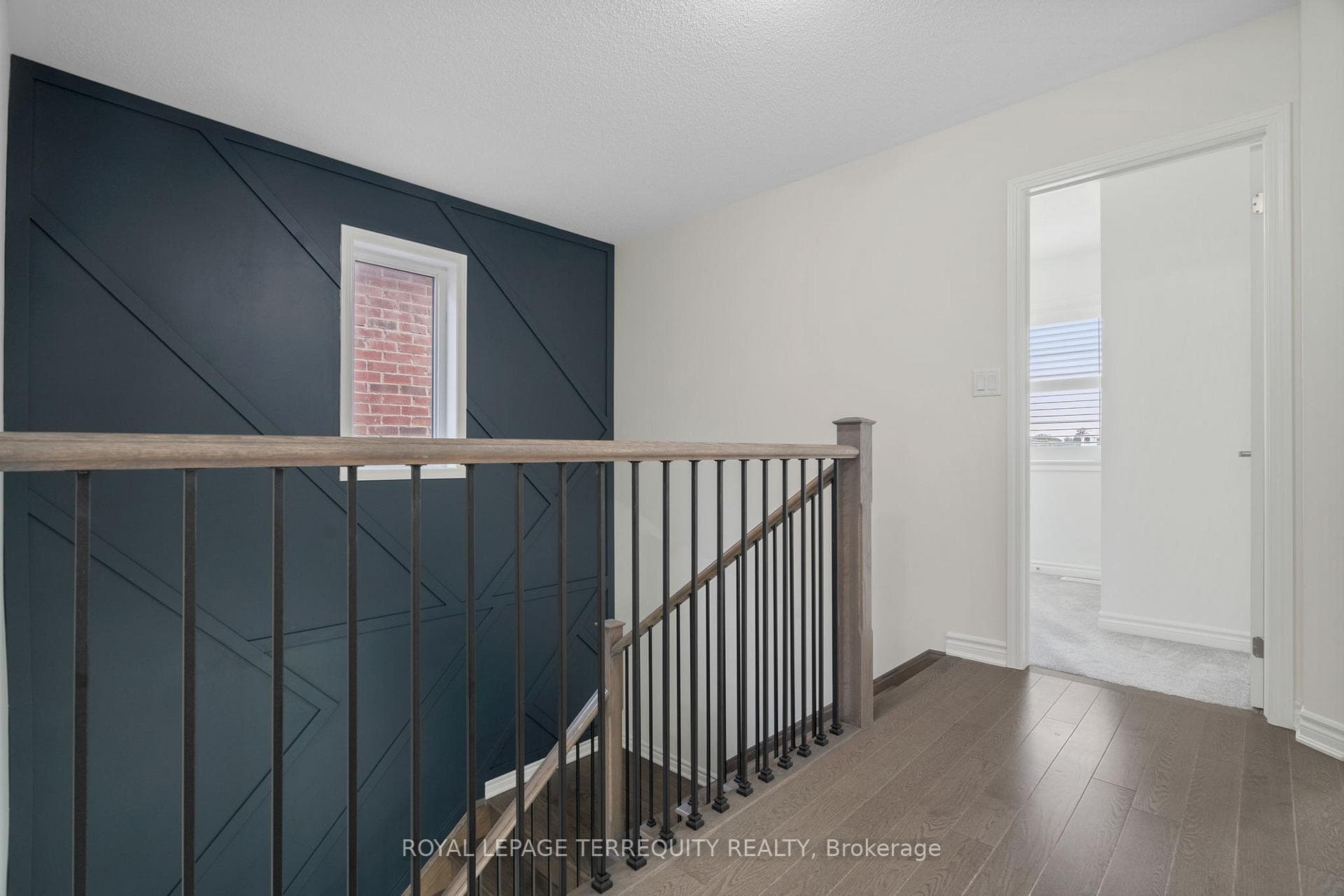 Hardwood Staircase With Accent Wall