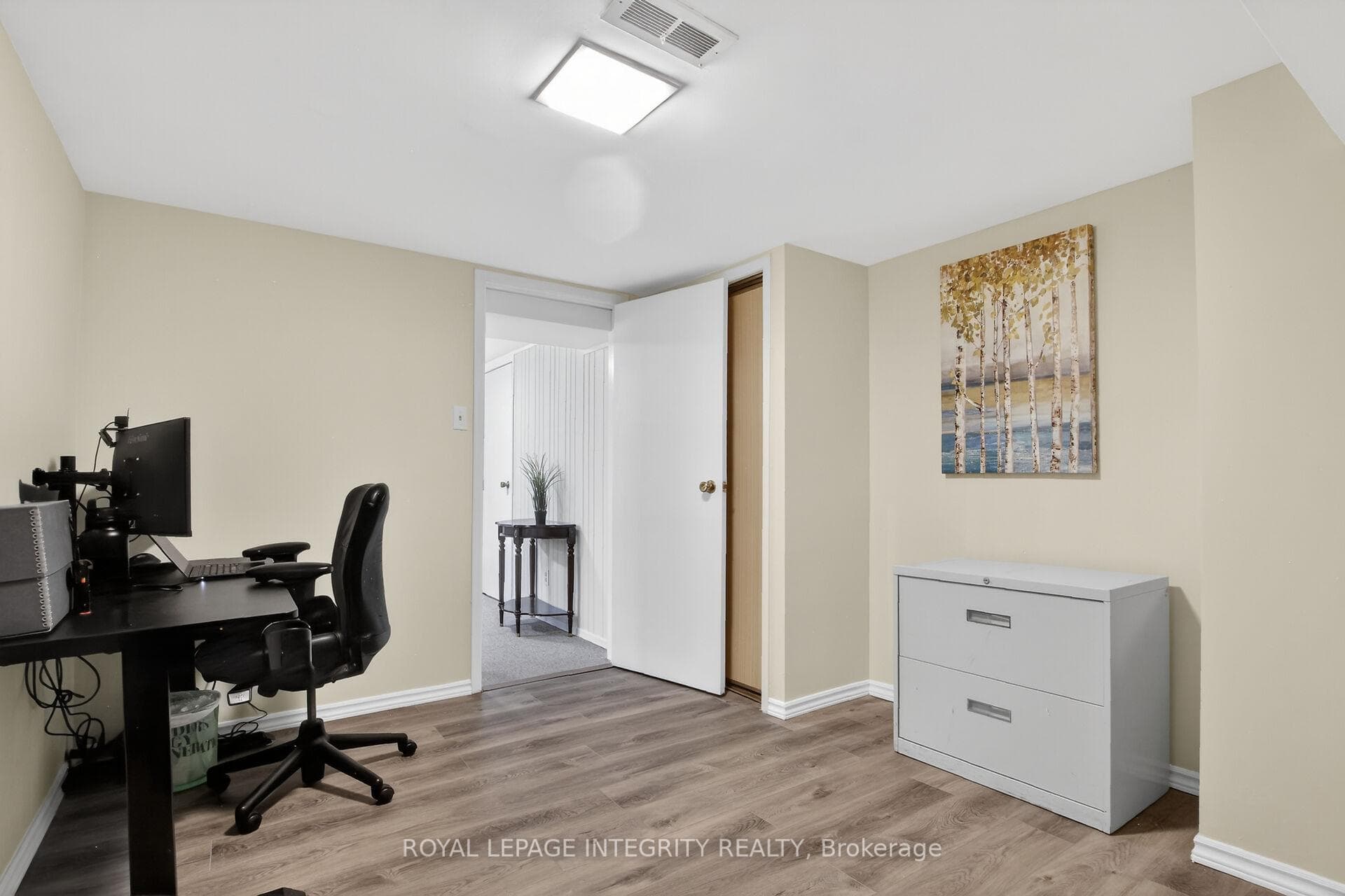 Bright den with new laminate floorin
