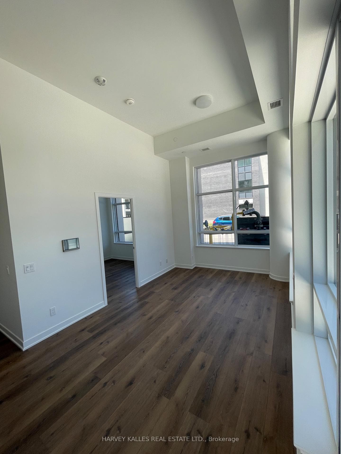 living room area / primary bedroom entrance