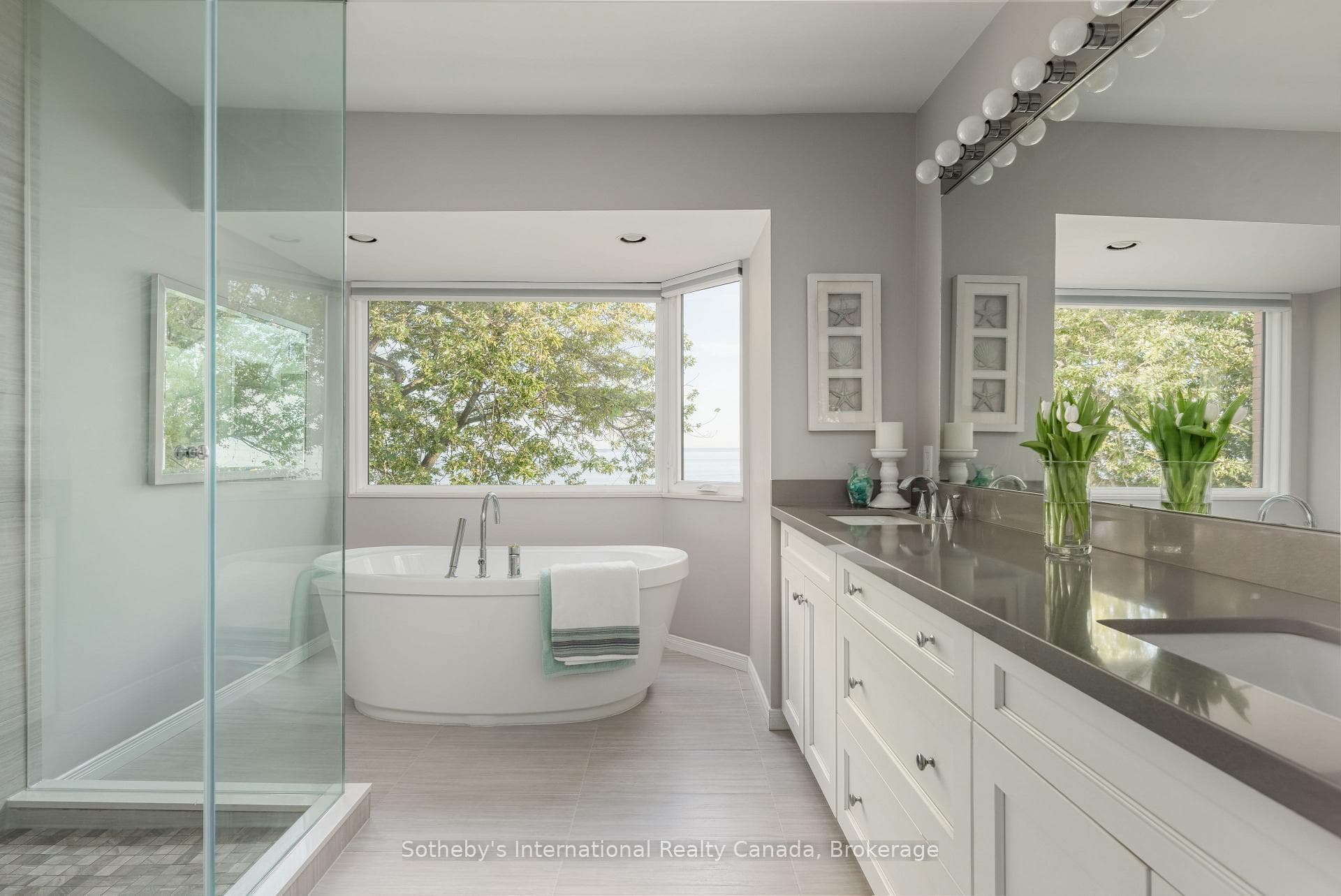 Ensuite with glass shower and bathtub