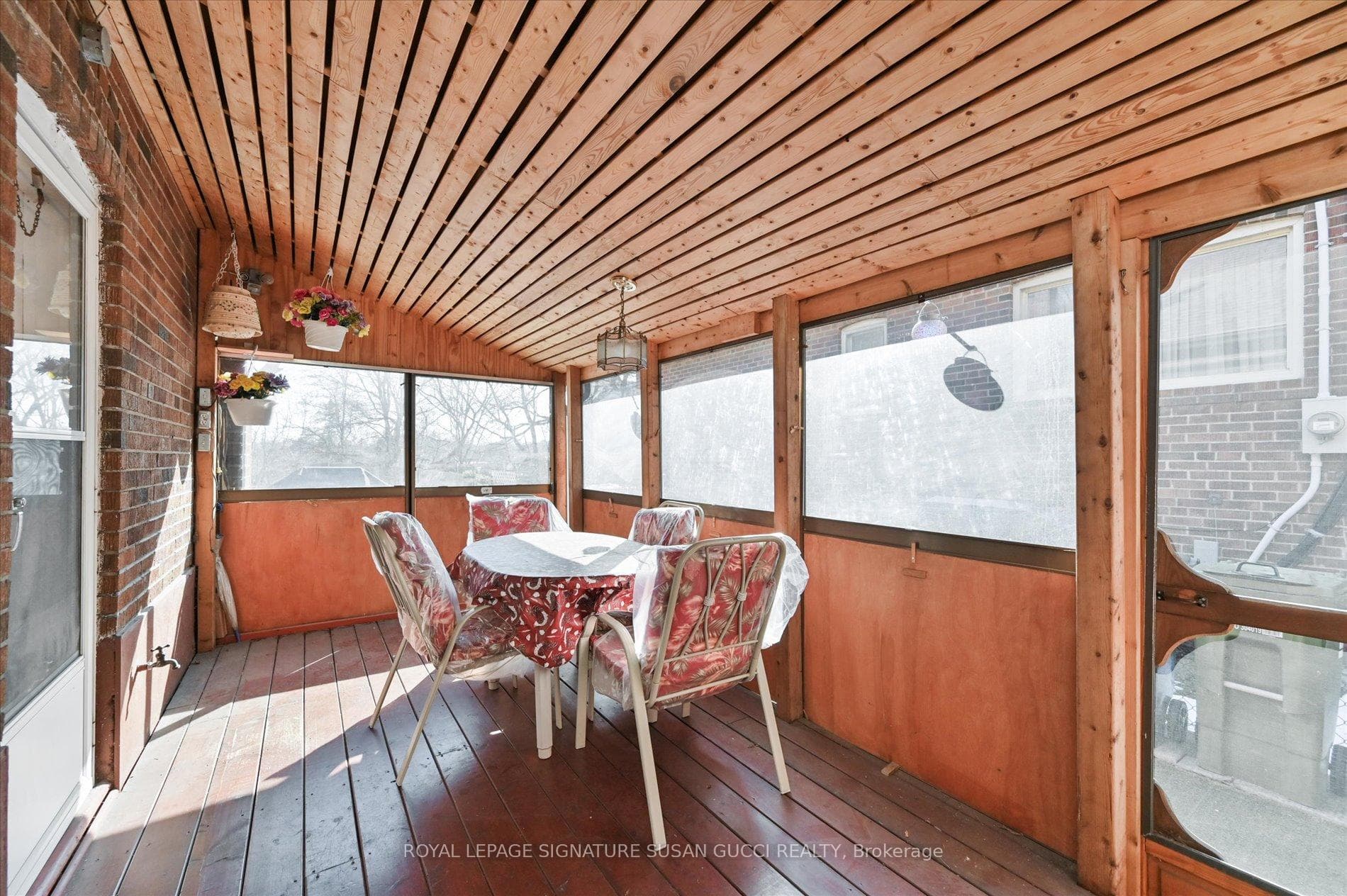 Covered back porch: enjoy summer rain showers