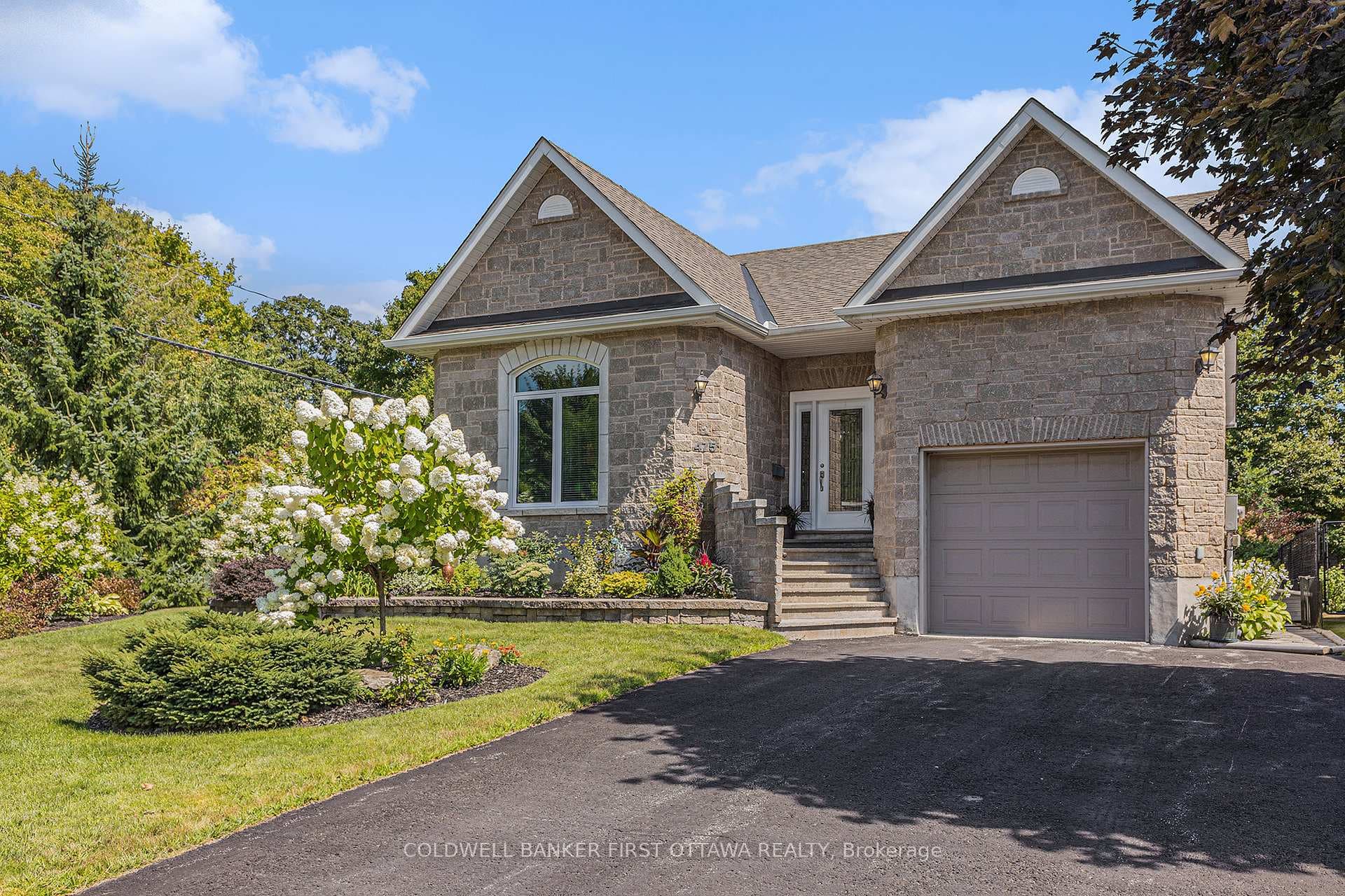 Summer view of home & landscaped yard