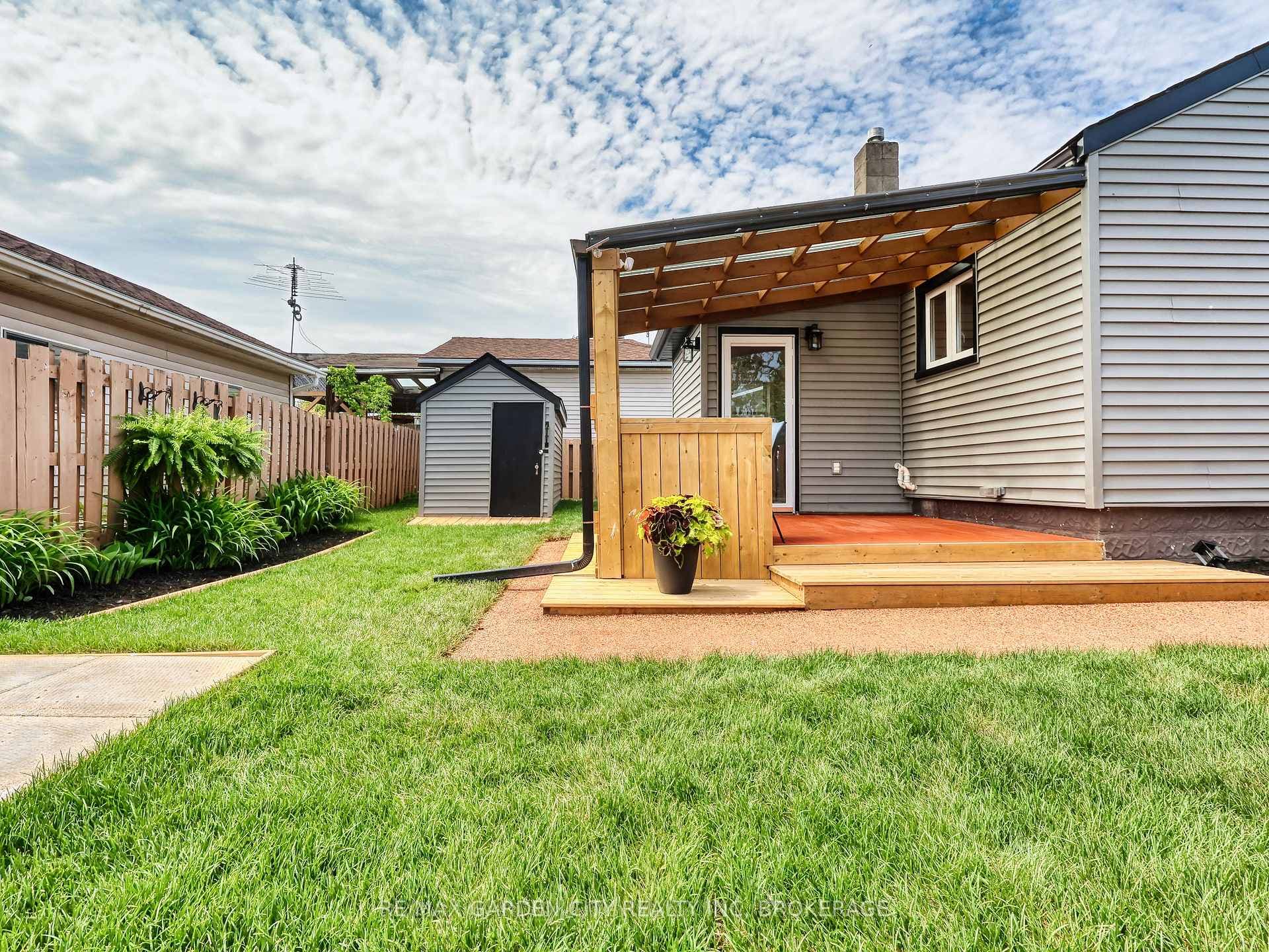 View of back yard with shed.