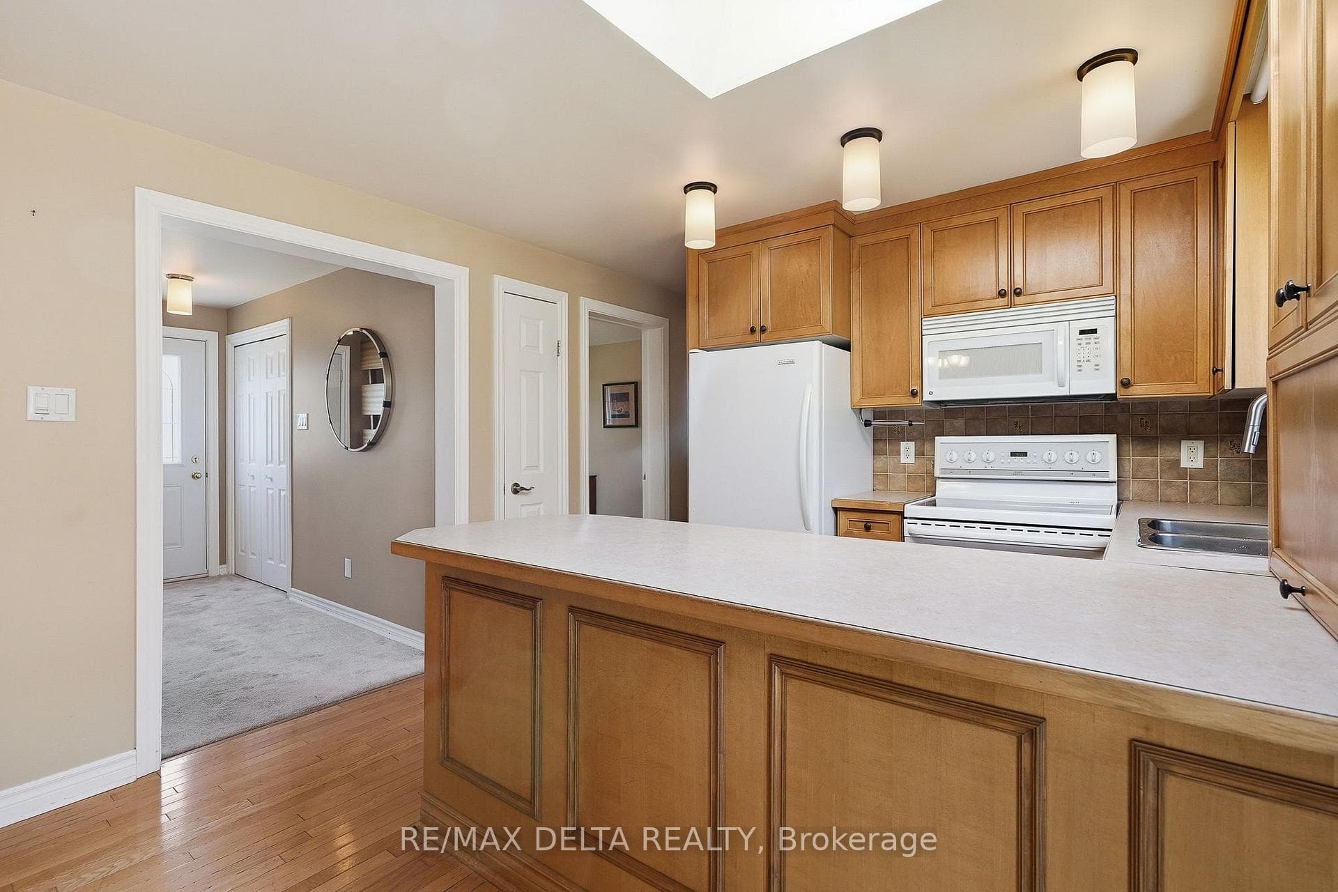 Kitchen connects to front hallway.